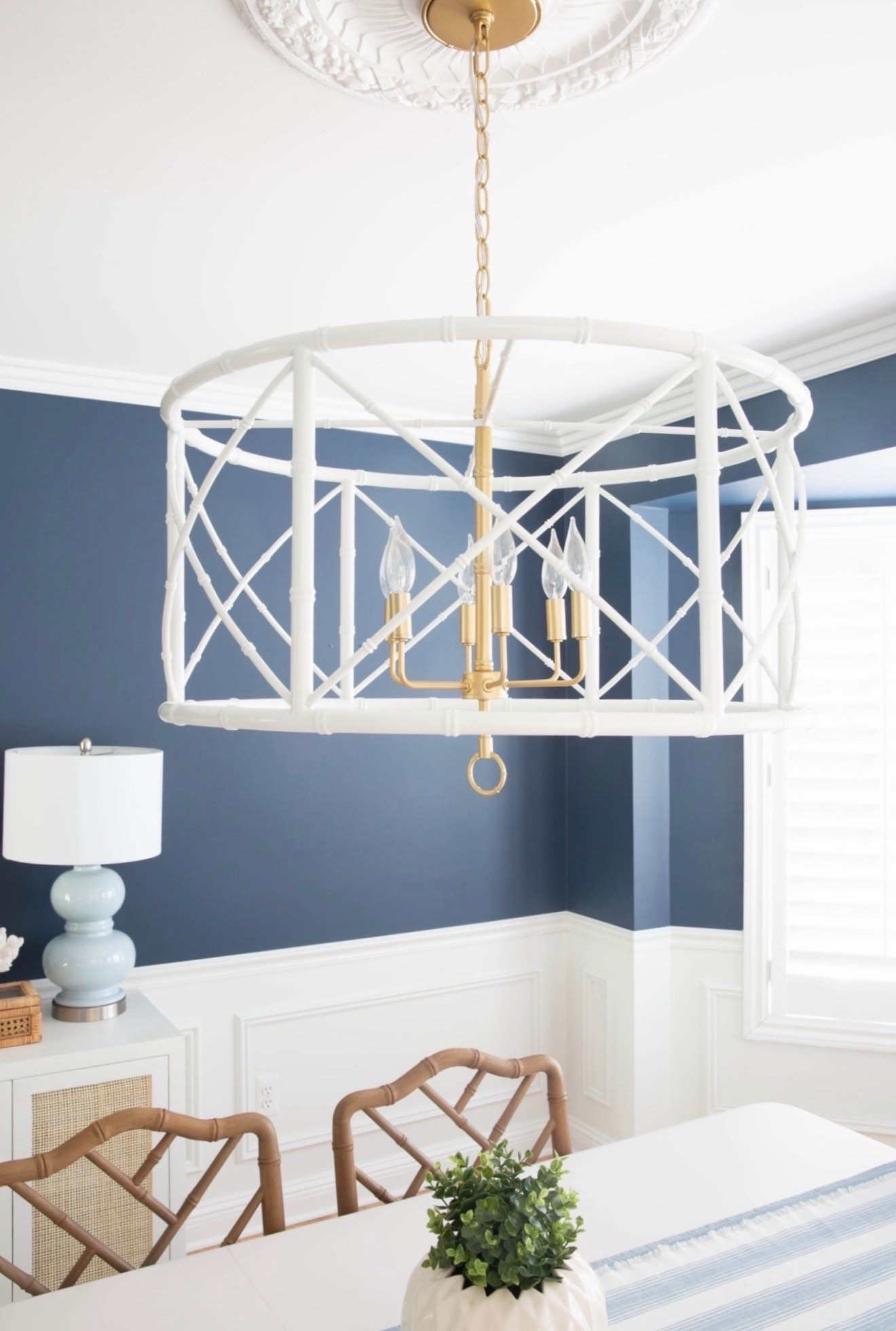 This white bamboo chandelier is the statement piece in my coastal dining room, adding natural texture and effortless coastal style. I love how it softens the space and pairs perfectly with blue and white decor for a bright, designer-inspired look. 

#LTKSaleAlert #LTKHome #LTKU
