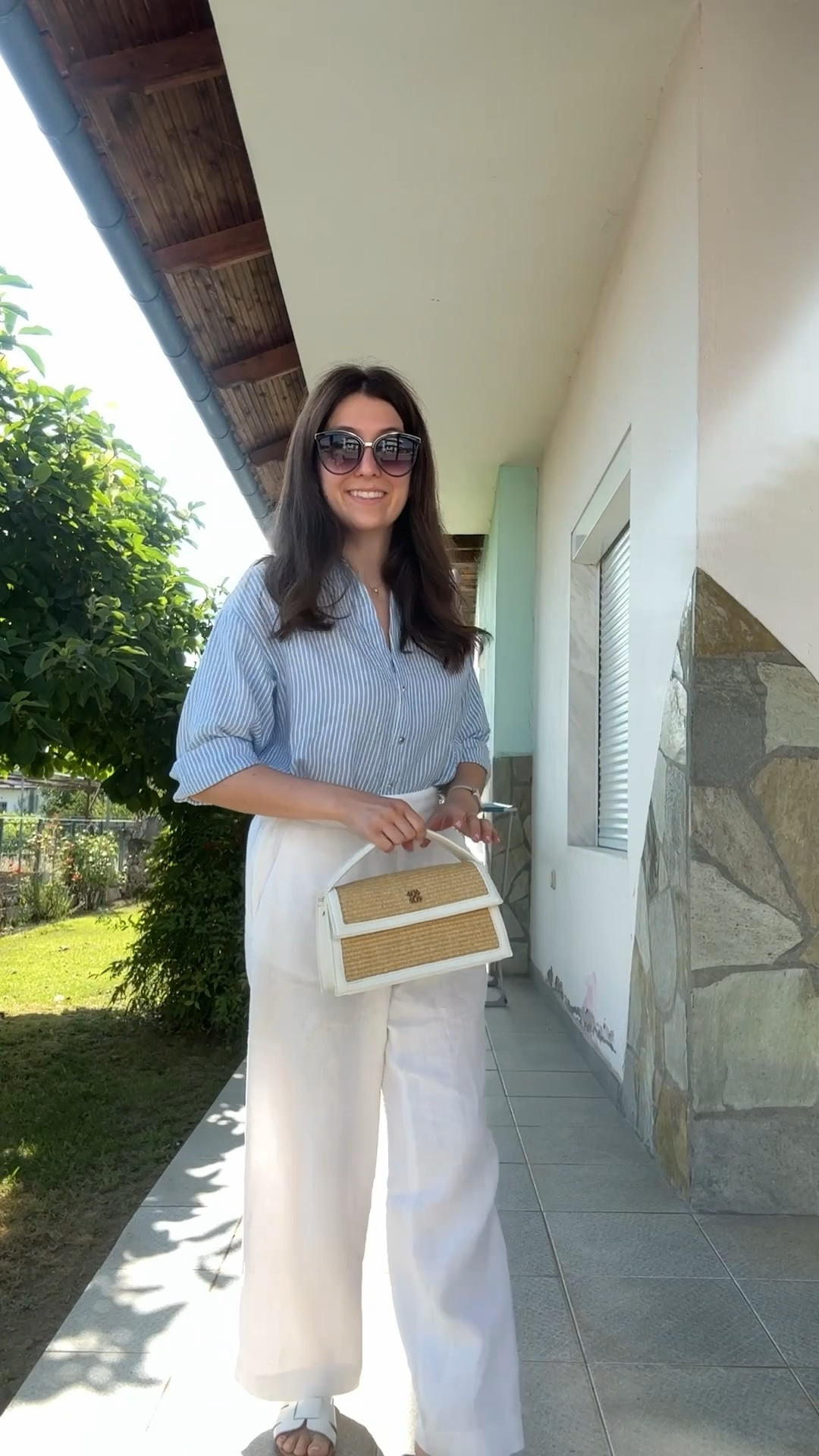 One striped shirt, two different looks!
On my trip to Greece I did my best not to overpack! The main reason because the dress I wore to my friends wedding was already big and took lots of space but I also planned to do some shopping there!
So I got with me items that matched together to create as many looks as possible! 
One of the items that I used the most was this linen blend striped shirt. I wore it at the beach (already posted this look) but I wore it in the city as well. For the first look I combined it with a pair of long linen trousers, white and rattan bag, white sandals and silver accessories. 
For the second look I went for a pair of navy blue linen blend shorts, a pink bag and same white sandals and gold jewellery. Yes, the white bag would definitely look better with the second look, I know! But my brother and the big suitcase left Greece a few days earlier than me and Alex. So I had to keep only one bag and I chose the pink because I needed it for my sister in law’s graduation!

Which look is your favourite?

#LTKeurope #LTKtravel #LTKsummer