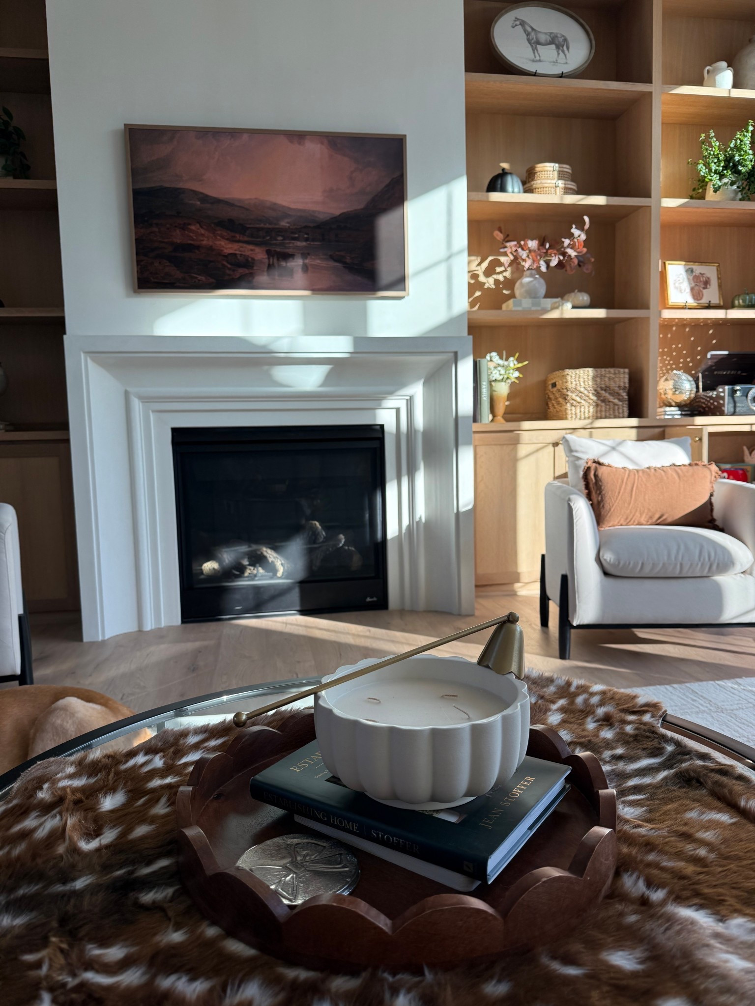 Cozy fall home decor! Animal hide layered rugs, rusty pillow cover! Coffee table styling 

#LTKHome #LTKSeasonal