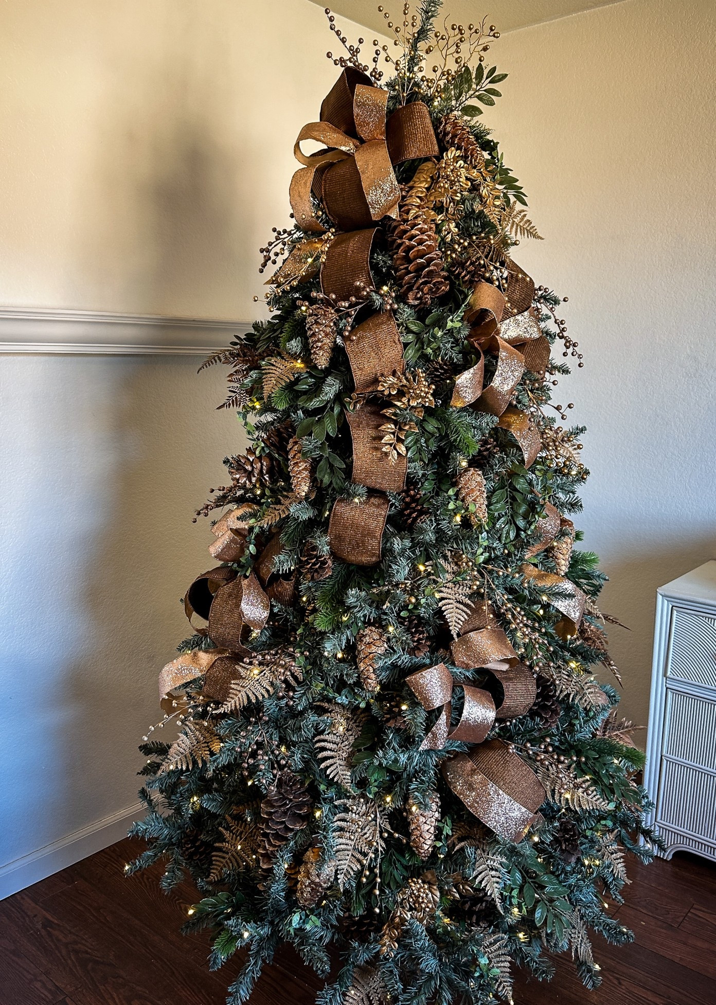 This tree is all about luxe textures and rich holiday greens ✨ Draped in golden ribbon with layers of timeless ornaments, it feels both classic and elevated. I’ve linked my favorite, the Tribeca Spruce Blue tree from King of Christmas, and a pine one ornament set,  so you can recreate this look in your own home 🌲💫

#LTKSeasonal #LTKOver40 #LTKHome