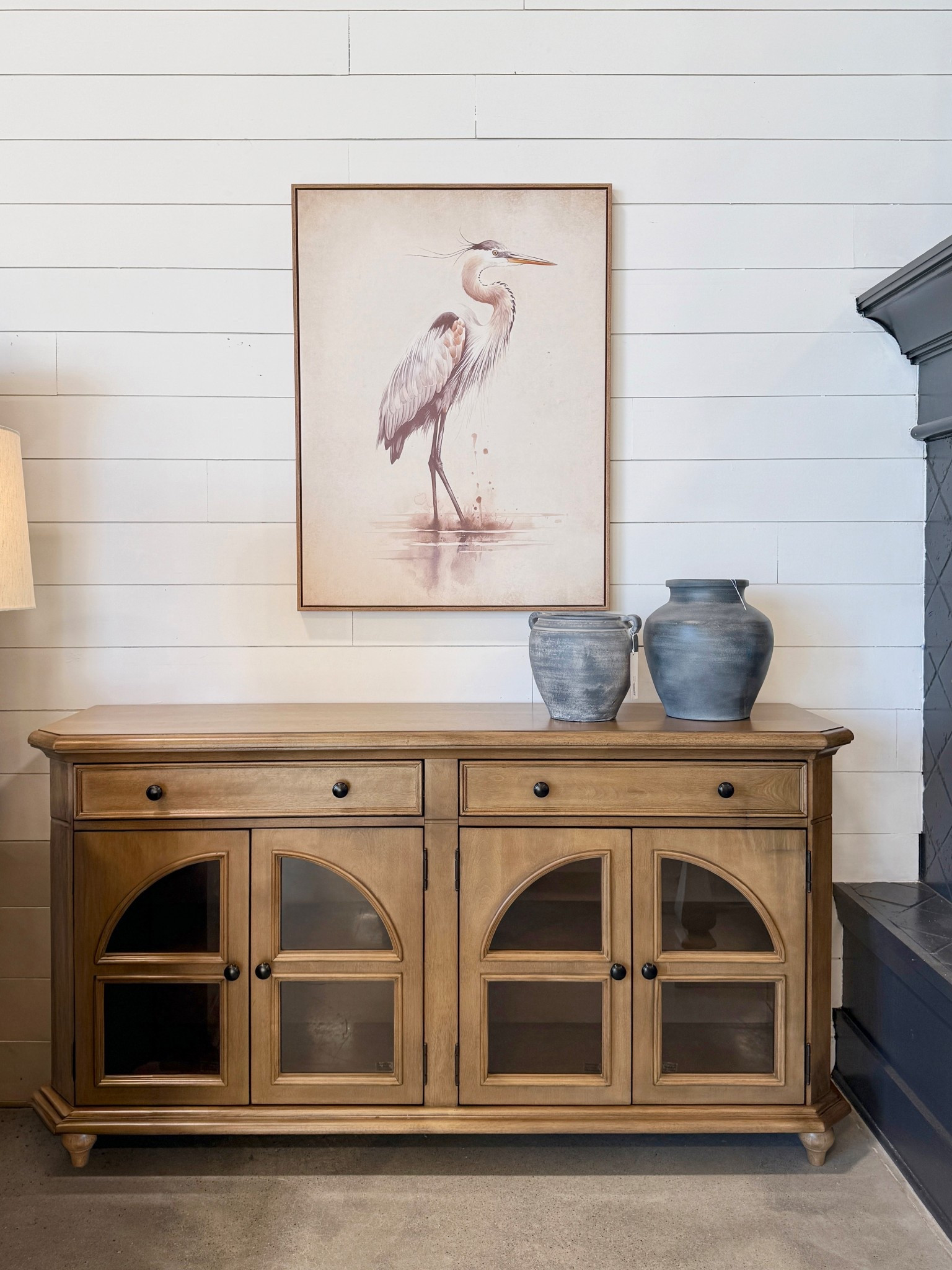 Classic storage with so much charm! ✨  The Barlomore Accent Cabinet from Ashley Furniture is one of those timeless pieces that works beautifully in so many rooms. 🤎 The warm light-brown finish paired with arched glass panel doors gives it an elegant, traditional feel, while the drawers and adjustable shelves make it super functional. Perfect for media, dining storage, or even an entryway setup. A really lovely balance of style and practicality! 💫 Linked here along with other similar accent cabinets to explore! ☺️ #Sideboard #Credenza  #DiningRoomInspo

#LTKSaleAlert #LTKHome