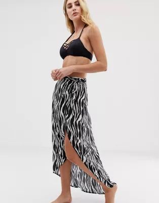Akasa Exclusive zebra print wrap beach skirt | ASOS US