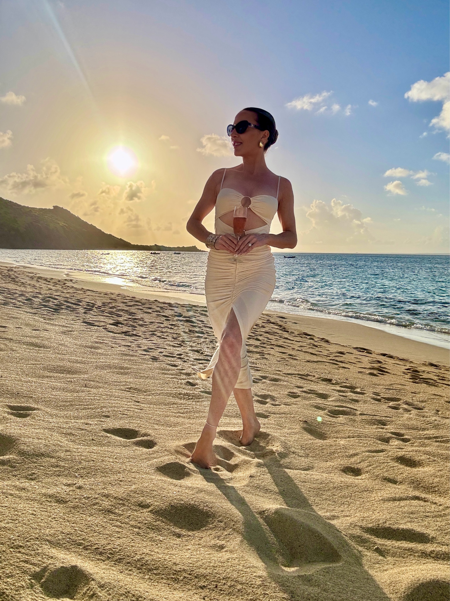 Vacation outfit, vacation dress, resort wear dress, sexy cut out dress, summer dress, cream midi dress with adjustable spaghetti straps for the perfect fit, gold sculptural teardrop earrings and lots of self tanner as I’m
a shade bather ☀️ 

#LTKSeasonal #LTKBeauty #LTKStyleTip