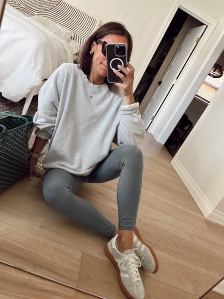 Soccer Saturday outfit 
Oversized sweatshirt is 30% off and I’m wearing the Xs/s 
Leggings are buttery soft and short gal friendly 
Sneakers run large I went down a 1/2 size 

#LTKOver40