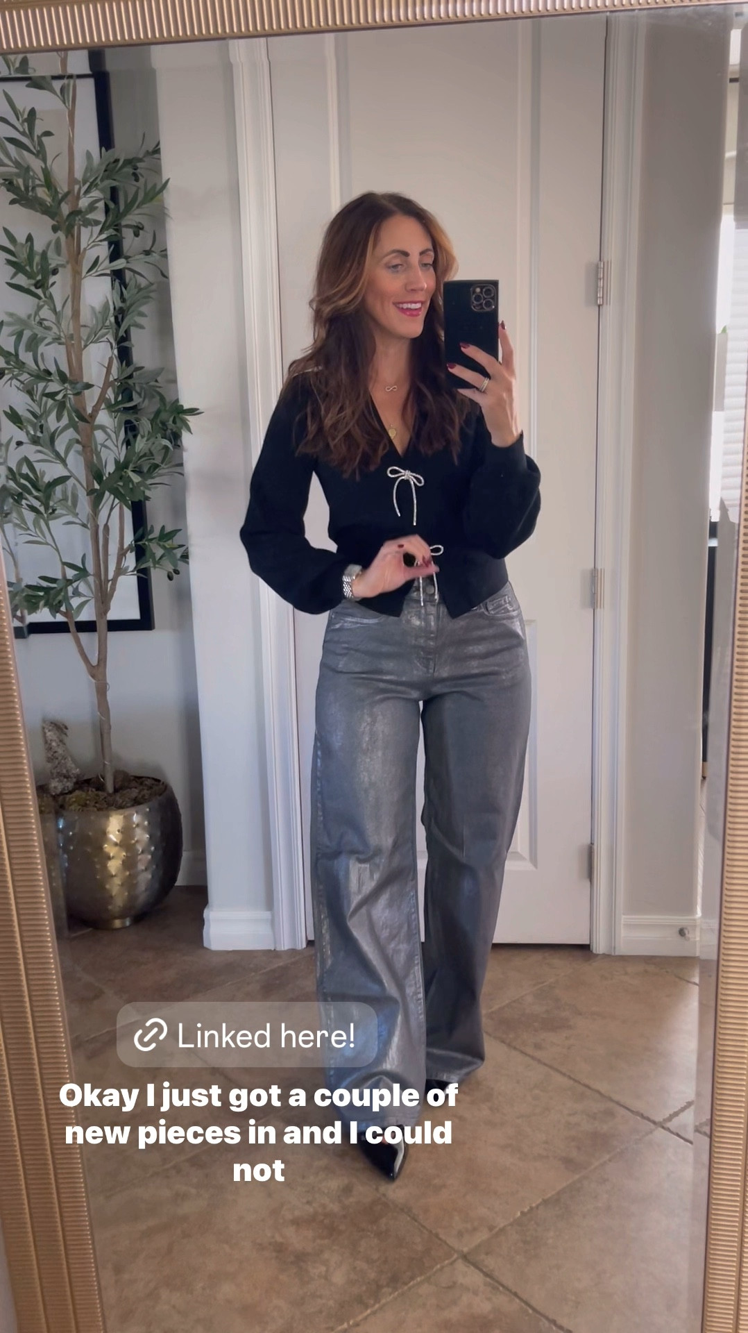 Holiday outfit idea! 🖤🪩// Crystal bow sweater cardigan with wide leg metallic jeans! 

- Sweater - size small 
- jeans - size 4 (run long, 31.5” inseam)
- patent leather bow kitten heels - size 8 (size up if in between)

Holiday style, holiday party outfit idea, holiday workwear, holiday sweater, festive sweater, bow sweater

#LTKHoliday #LTKVideo #LTKFindsUnder50