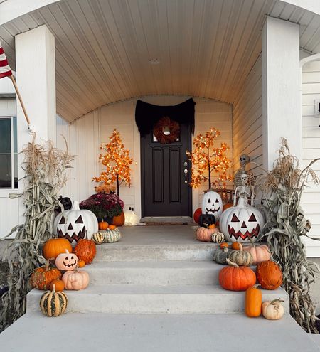 Front porch Halloween decor 🎃🎃 Linked my Amazon pre lit trees for around $50. Lowes pumpkins/Jack O Lanterns, and some skeletons!

#LTKHalloween #LTKhome