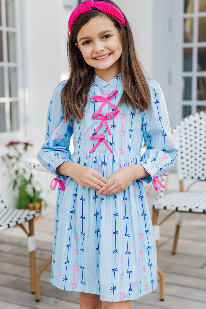 Girls: The Baileigh Light Blue Bow Print Dress | The Mint Julep Boutique