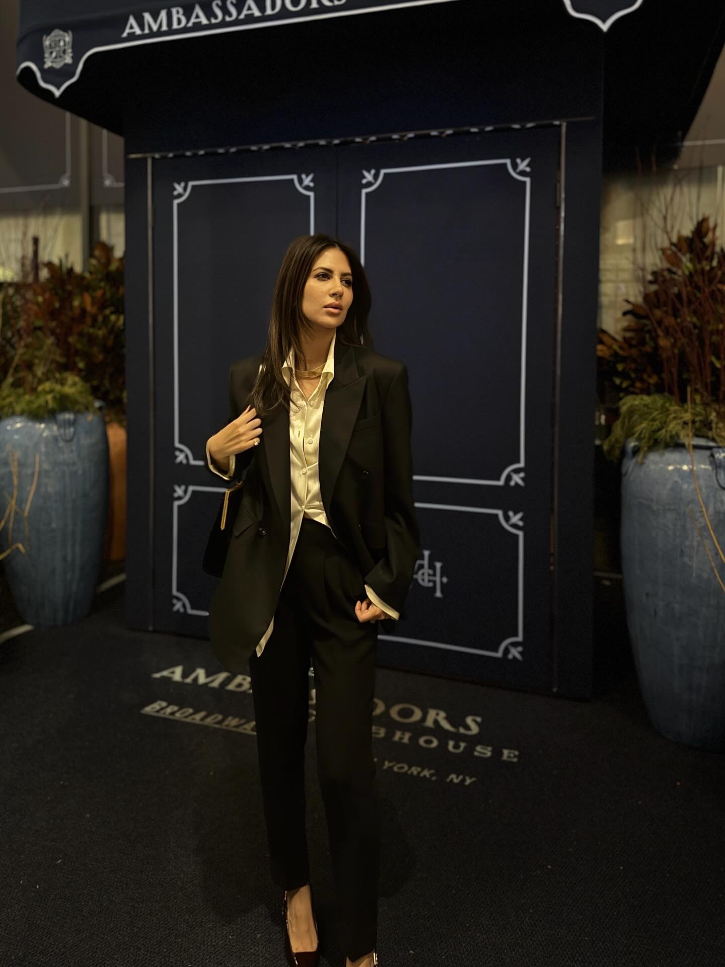 Finally made it to one of the hardest reservations in NYC right now and the outfit had to match the moment.

Black tailoring, a cream silk button-down, a gold choker. A menswear inspired formula built on elevated basics, sharp tailoring, and minimal details — it never goes wrong.

Save this for your next NYC night out. 
Follow for more of the NYC edit.