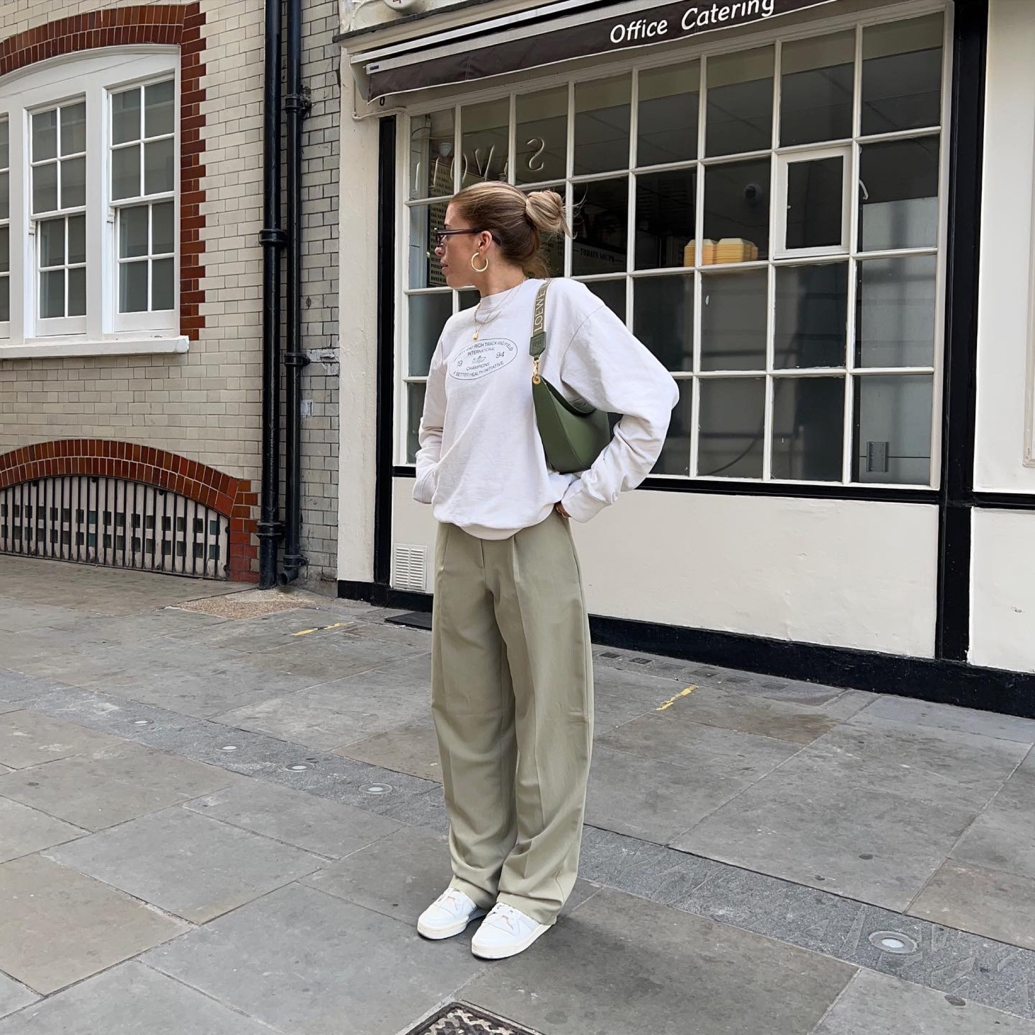 Green trousers teamed with a sporty and rich cream sweatshirt, cream trainers and Loewe Luna bag 

Jumper - size small 



#LTKstyletip #LTKeurope