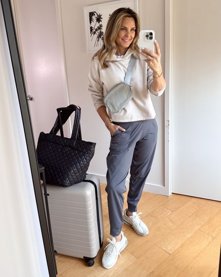 Amazon joggers in gray sz S 
-Zella hoodie in a pretty warm cream color. So soft on the inside! Sized up to a Medium 
-Vulori tee that is cropped and so comfy! Wearing XS
-Nike sone sneakers 
-A favorite Travel tote
-Away luggage 


#LTKunder50 #LTKover40 #LTKtravel