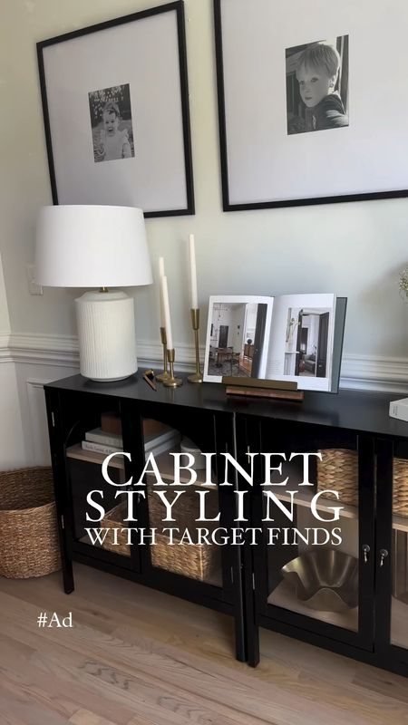 Styling my affordable cabinet from @target for spring! #ad This arched cabinet is one of my favorites in my home. It is only $190 and makes such a statement. I pushed two together to create a sideboard in my dining room and styled it with decor all from Target. Everything is linked to my Target Storefront, and all details are below!

 -Ceramic table lamp designed with Studio McGee Set
•I LOVE this lamp, it’s a stunner.

 -Wood book holder by Hearth &Hand with Magnolia 

-Decor books: At Home, Abode & The Art of Home & Pacific Natural At Home
•some of my favorite to style with! 

-Black ceramic planter
•I love the texture and ribbed detail on this one 

-Set of 3 gold taper holders, ribbed candles, and metal and wood cable snuffer.

 -Large round braided seagrass basket. 
•I love placing baskets in corners for added texture and a place to put misc items like blankets or shoes. 

-Woven water hyacinth folio bin 
•This was the perfect size to add inside the cabinet for some warmth and texture

 -Small brown box with lid by Studio Mcgee to add a little warmth 

-Round marble decorative box by Studio McGee 
•You can style this with the lid on or even placed off beside it 

-Moody trees framed canvas by Studio McGee 

-Wavy metal gold bowl by Studio McGee with cream flower fillers

 #Targetpartner #paidlink #targetfinds #targethome #archedcabinet #cabinetstyling #homestyling #interiordesign

#LTKhome #LTKfindsunder50 #LTKsalealert