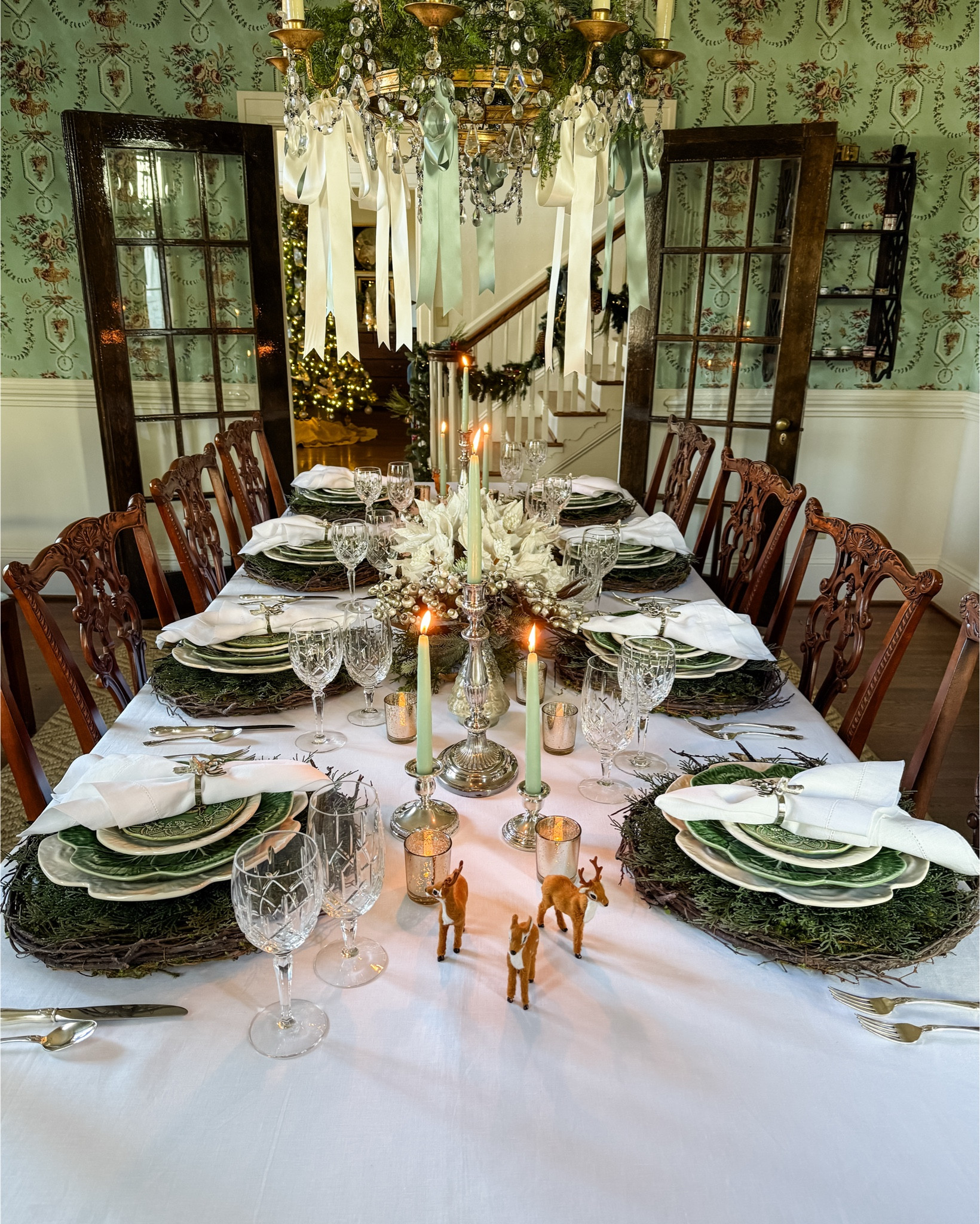 What’s your holiday table style—classic elegance or full-on festive flair? 🎄✨ For my Christmas tablescape, I went all in with mercury glass trees, silver candle holders glowing with green candles, and adorable mini reindeer accents. The centerpiece is a dreamy mix of greenery, frosted pinecones, white poinsettia blooms, and glittery silver berry stems for that extra sparkle. The silver reindeer napkin rings are the final touch, tying it all together with a bit of holiday magic. It’s the little details that make the season shine!🎄

How do you style your holiday table? Do you prefer a subtle, minimalist look or a bold and festive vibe? Let me know in the comments! 
🎄✨🎄✨🎄✨🎄

#HolidayTableDecor #ChristmasTablescape #FestiveTableSetting #HolidayDecorGoals #TablescapeInspiration

#LTKSeasonal #LTKHoliday #LTKHome