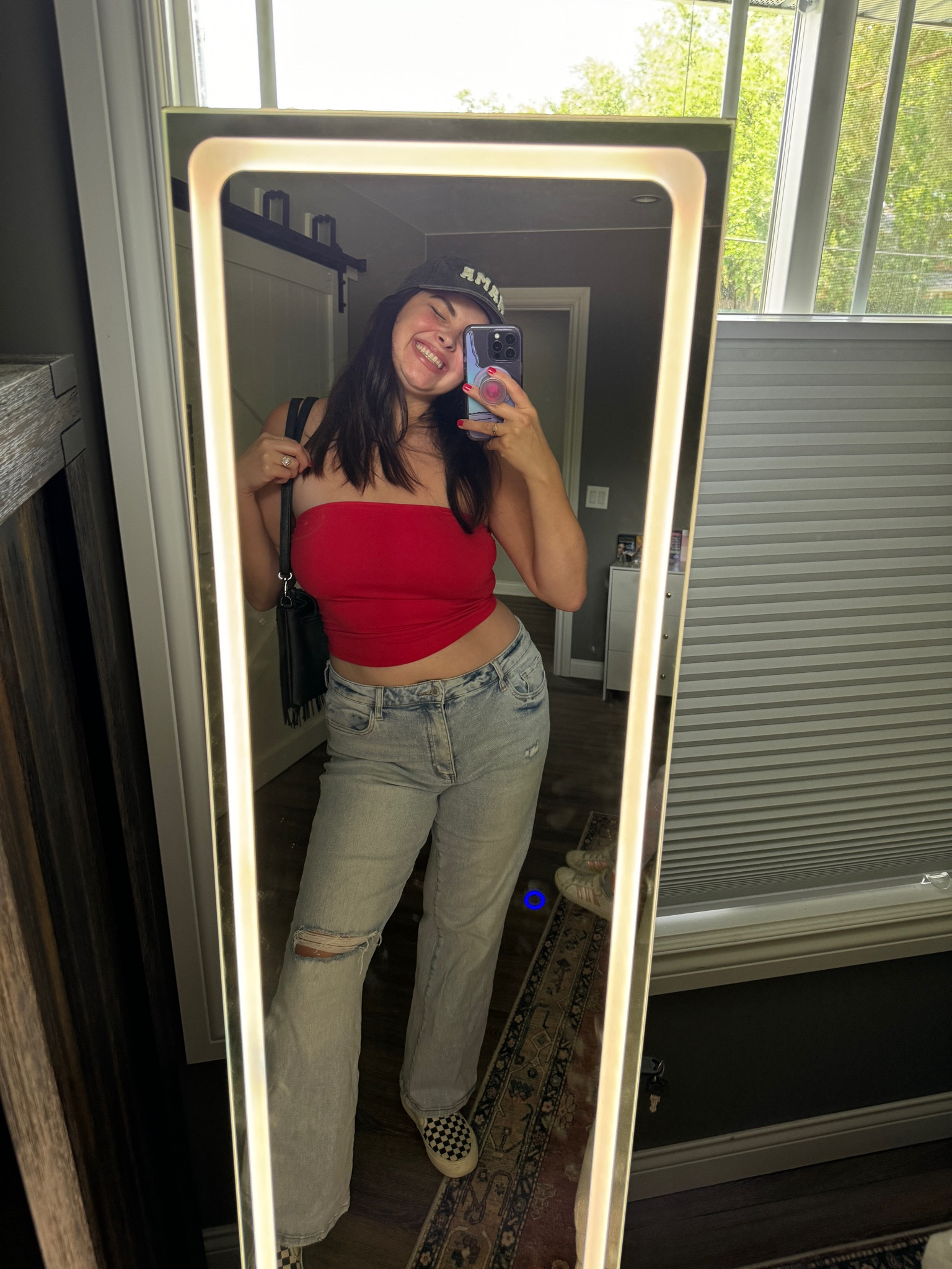 strapless red tube top and distressed 90s flare jeans with fringe black purse and mama hat 

#LTKFindsUnder100 #LTKFindsUnder50 #LTKMidsize