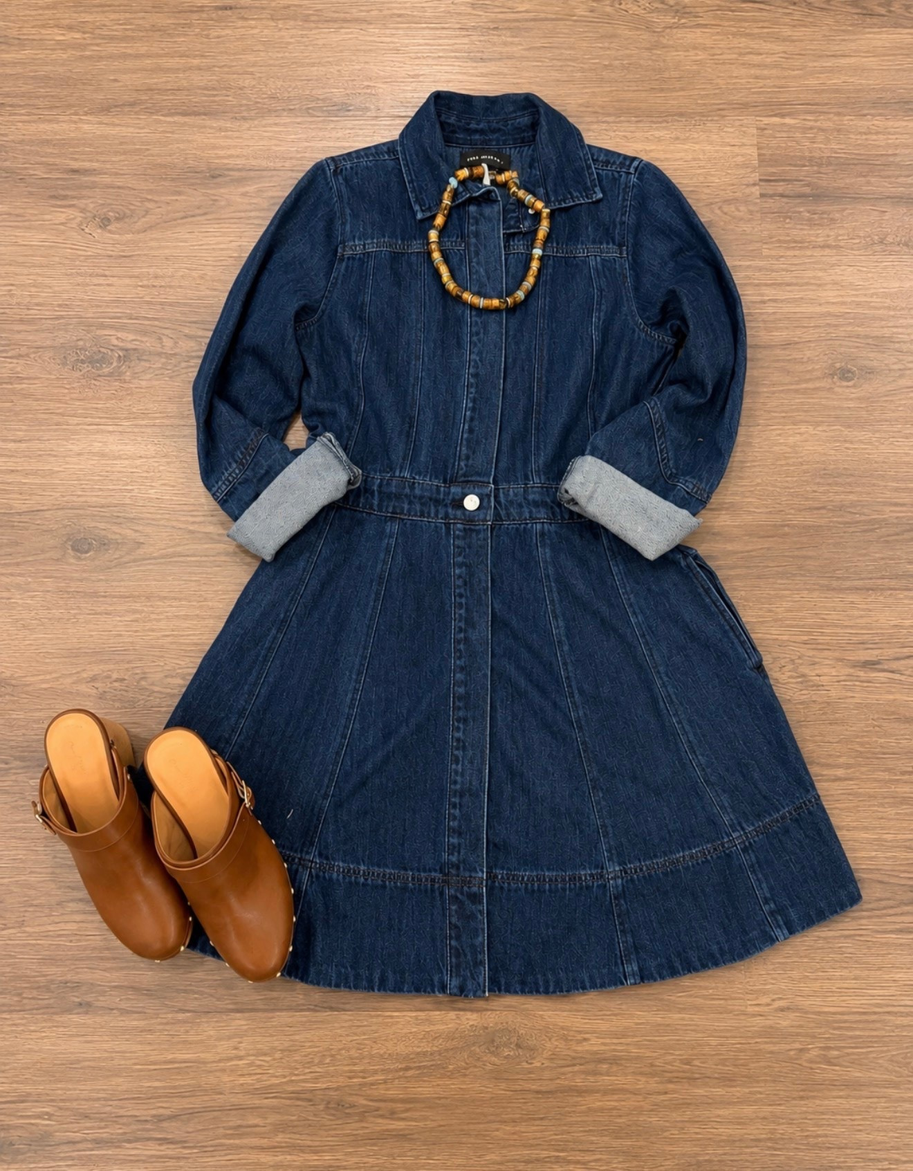 Timeless, versatile denim mini shirt dress under $40 wearing a size extra small. I love it paired with your favorite mules, clogs, or boots can be dressed up or down.