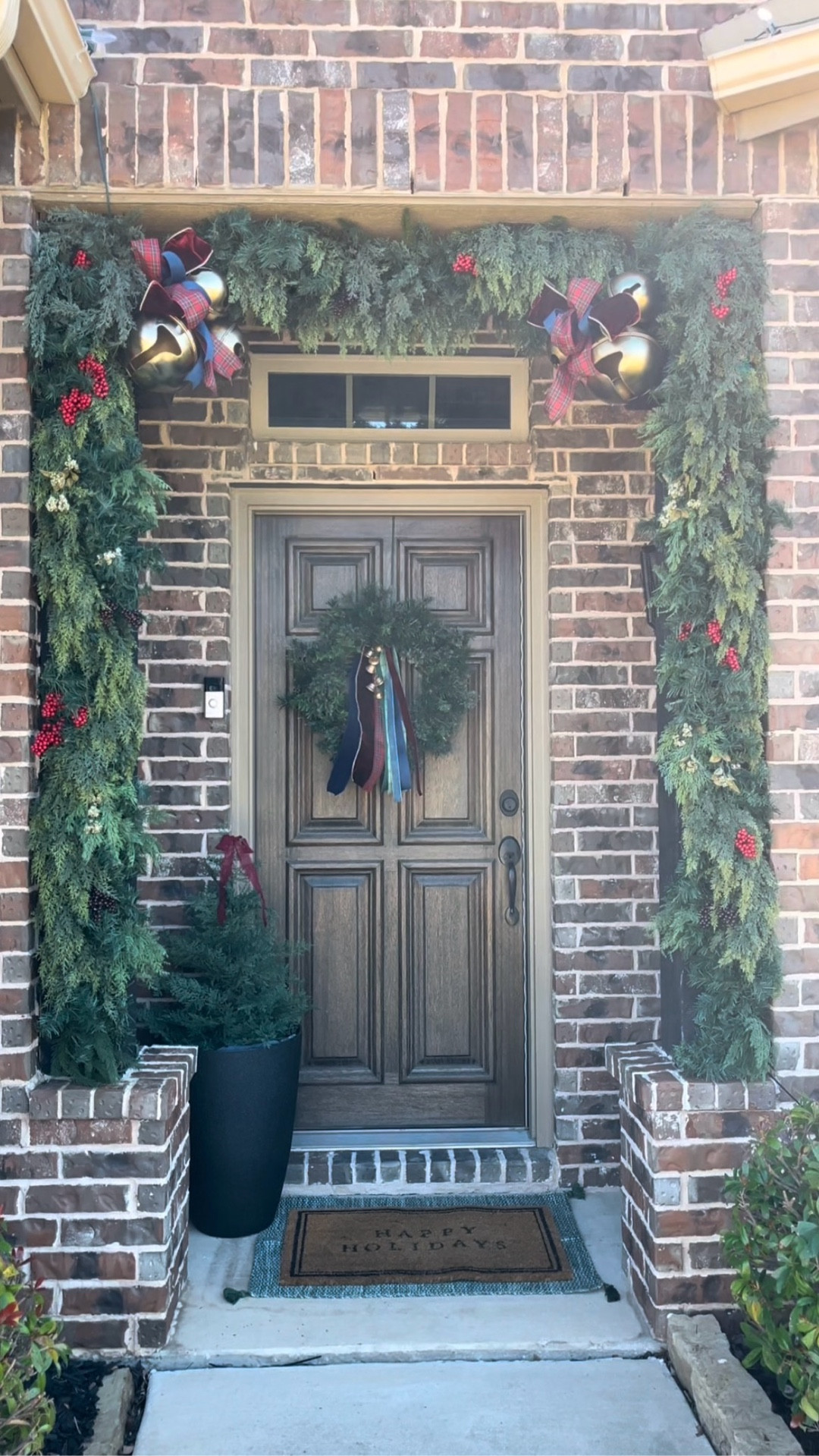 Our holiday porch is officially decked. ✨

This year I leaned into an old-fashioned Christmas theme with red, rich burgundy, navy, and classic plaid. I layered different garlands to make it lush and added berry stems. The gold bells pulled the look together. I absolutely love the results. 

#LTKHome #LTKCyberWeek #LTKHoliday