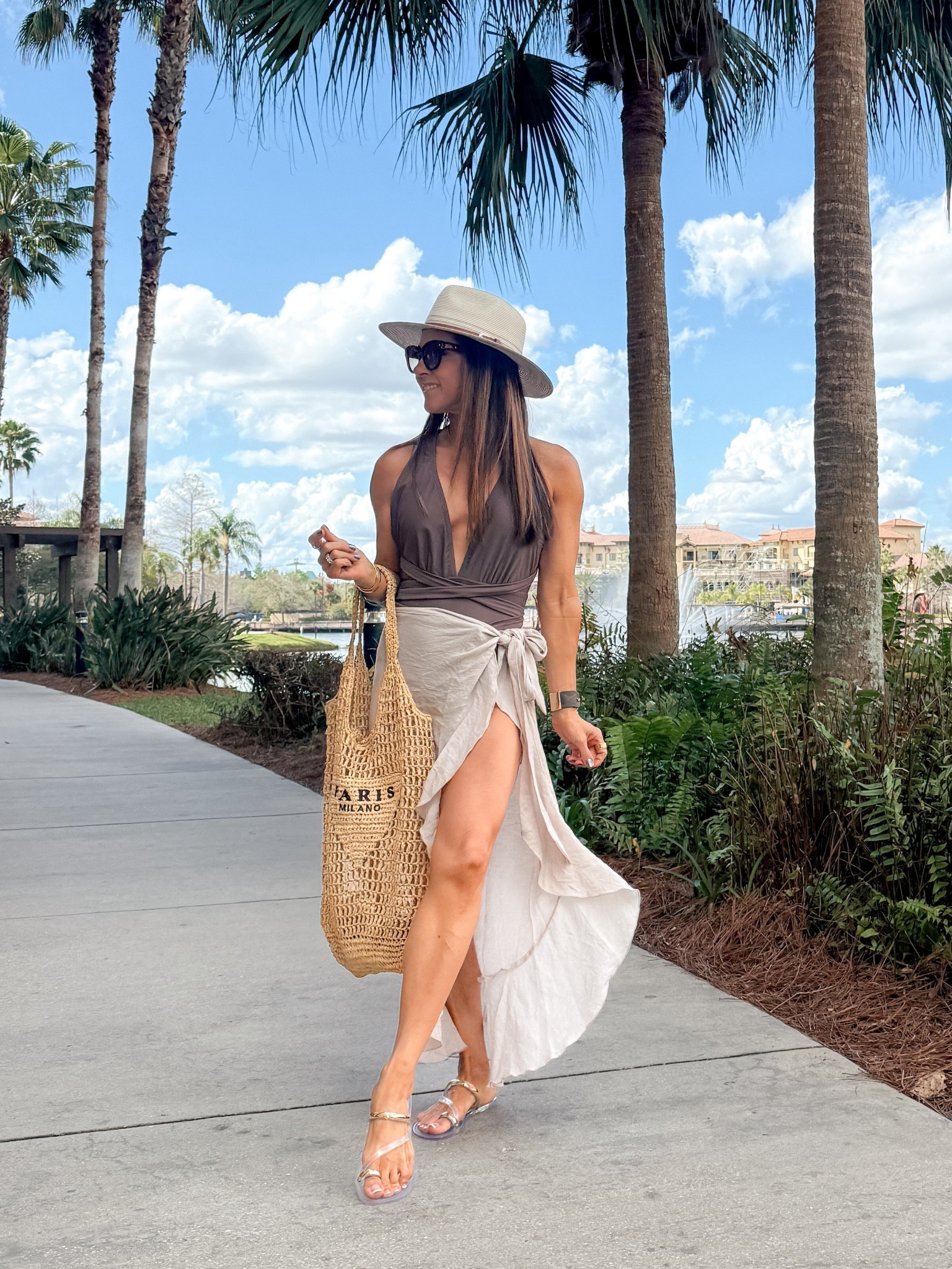 One of my favorite go to swimwear outfits! I absolutely love this flattering one piece, swimsuit Small, and wrap sarong cover-up. These clear slides go with everything and this designer inspired swim bag is super cute! 

#LTKSwim #LTKOver40 #LTKPetite