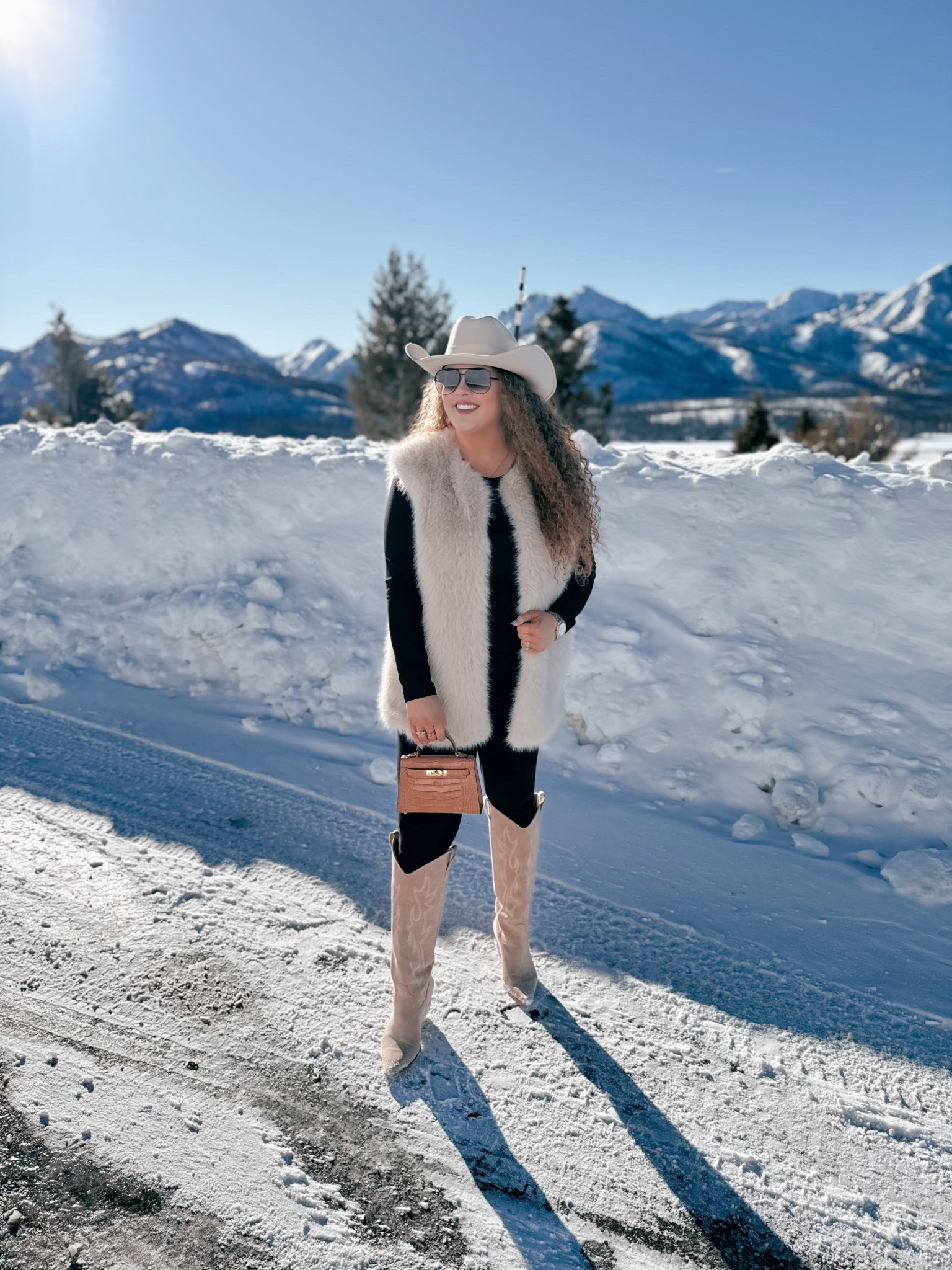 Western winter looks just hit different 🤍🤠 This is one of those outfits that feels easy but still makes a statement ❄️ Cozy layers, western touches, and snow day vibes. Everything I can link is here ✨ western winter outfit | cowgirl hat amazon | beige cowgirl hat | amazon western fashion | black fitted top amazon | western layering outfit | fur vest western look | winter cowgirl style | beige cowgirl boots amazon | amazon cowgirl boots | western snow outfit | casual western outfit | amazon aviator sunglasses | western accessories women | cozy western winter look | western outfit women | amazon fashion western | winter rodeo outfit | modern cowgirl style | cold weather western outfit

#LTKMidsize #LTKgrwm #LTKootd