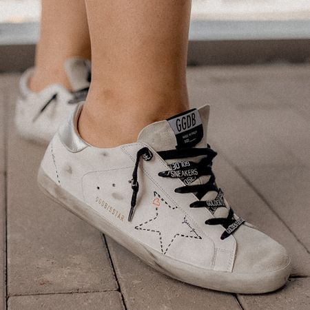 If you don't have a pair of Golden Goose Superstars in your closet, what are you even doing? These babies are my absolute fave because they're the perfect mix of stylish and comfy. Plus, they give off that effortlessly cool vibe. I mean, have you seen the distressed detailing?! *chef's kiss* 💋 

#LTKGiftGuide #LTKshoecrush #LTKHolidaySale