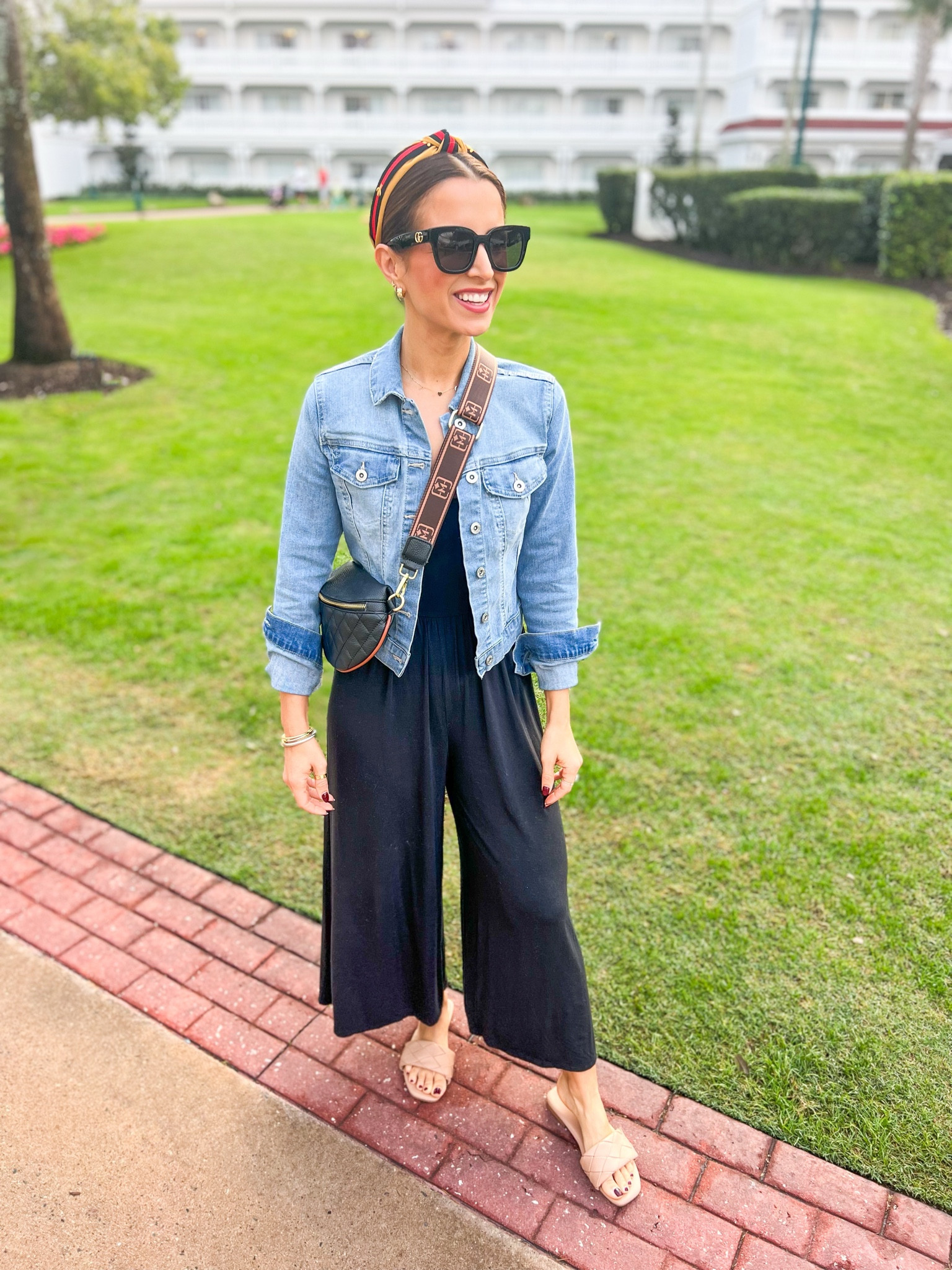 Travel outfit. Casual outfit. Elevated casual. Favorite Aritzia jumpsuit in 2XS (so soft and just the best!!). Favorite Amazon denim jacket in XS, color mauve. Gucci sunglasses. Amazon sandals are TTS. Huggie hoop earrings. Amazon belt bag. 

#LTKfindsunder50 #LTKshoecrush #LTKtravel