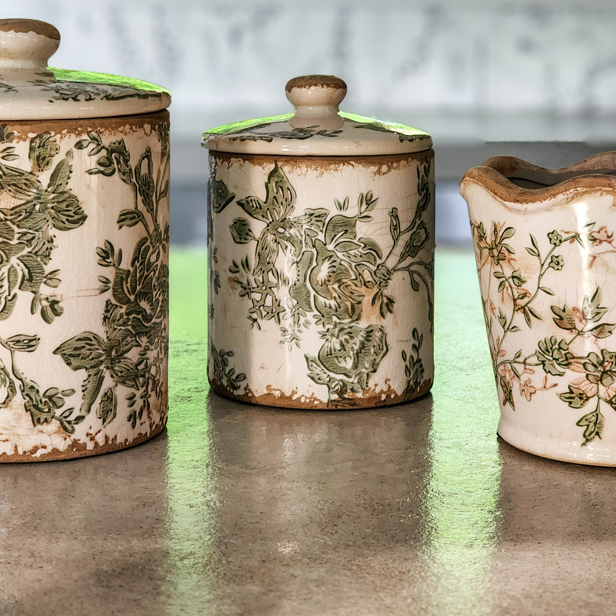 I love the vintage inspired green and white floral distressed canisters and vase with a scallop rim - perfect for styling any room in our home!

#LTKFindsUnder50 #LTKHome