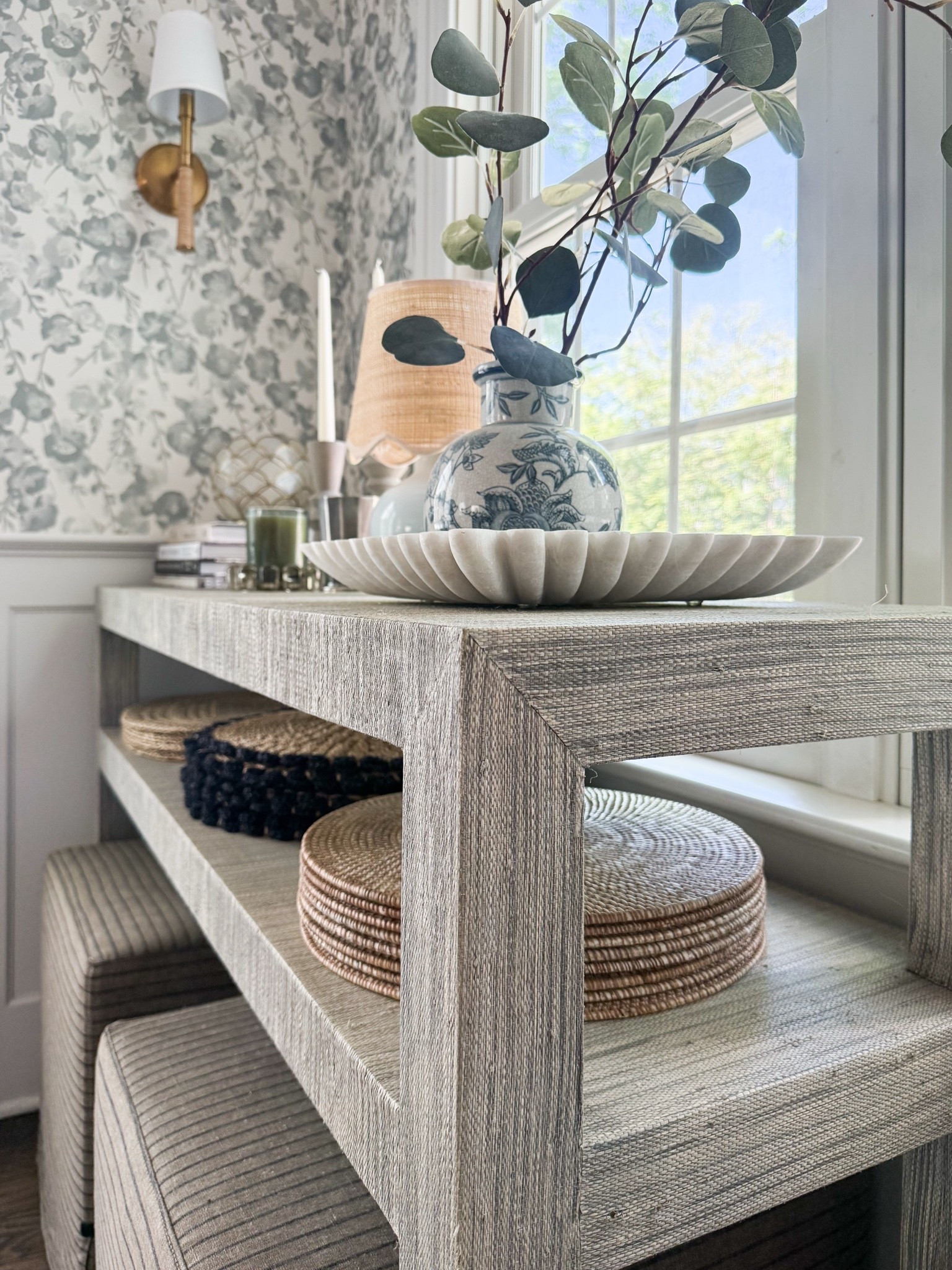 I like to use pieces of furniture in unexpected ways: this Serena & Lily grasscloth console was actually purchased for our entryway but I moved it to our breakfast nook a few years ago and now it holds entertaining pieces (placemats, votives, trays and candles)

#LTKSaleAlert #LTKHome #LTKmorningroutine