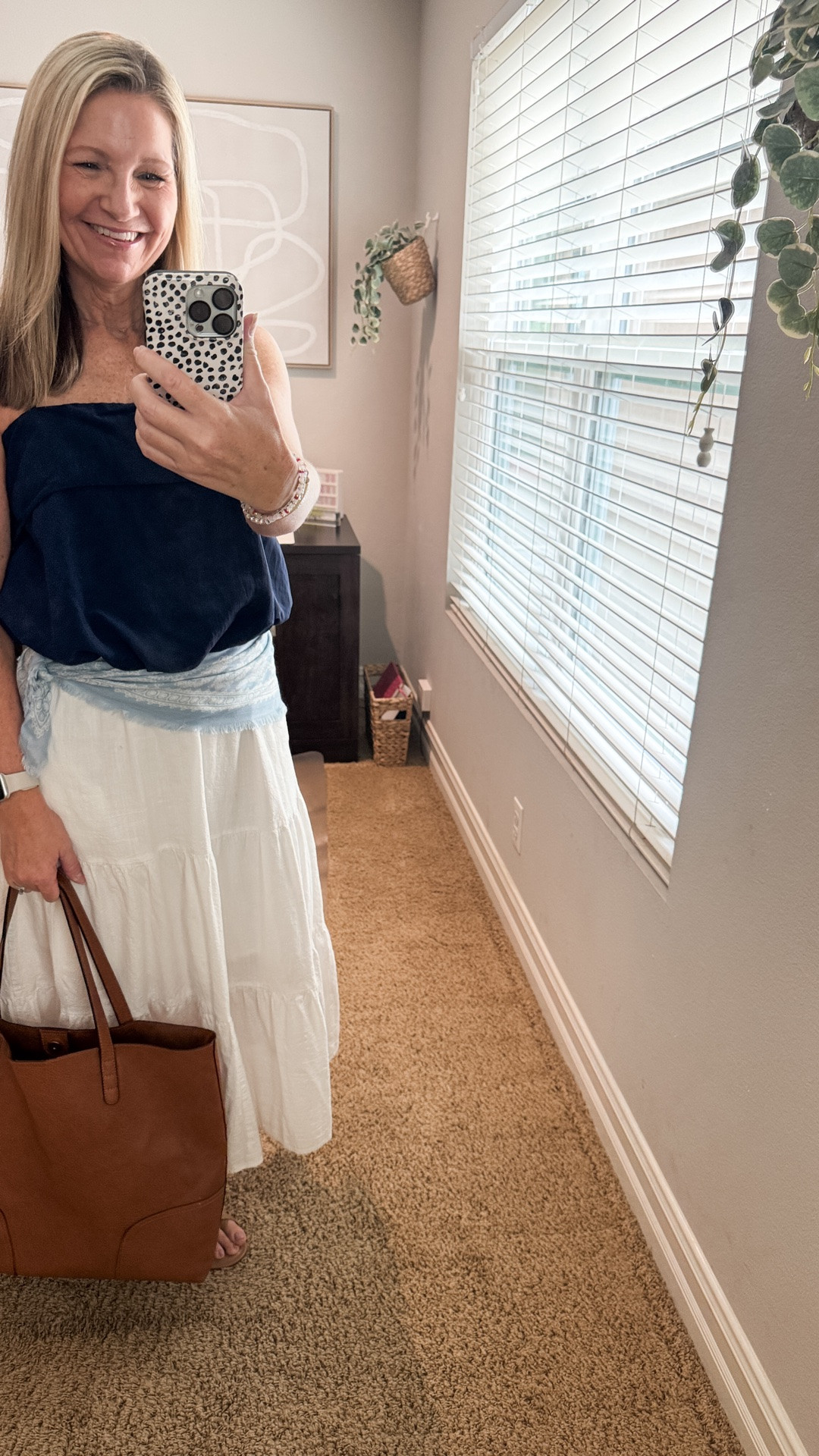 The scarf trend is one I haven’t tried until I came across this pretty baby blue one at Target. I had planned to just tie it to my purse but decided to try styling it around my waist and I love how it changed the whole look. 

My white maxi skirt is Amazon and I own it in several colors.

#LTKootd #LTKWorkwear #LTKOver40