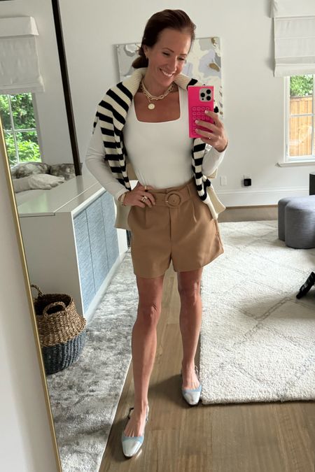 Tailored shorts paired with a striped sweater over the shoulder make for a chic summer outfit for a chilly evening 

#LTKStyleTip #LTKFindsUnder50 #LTKOver40