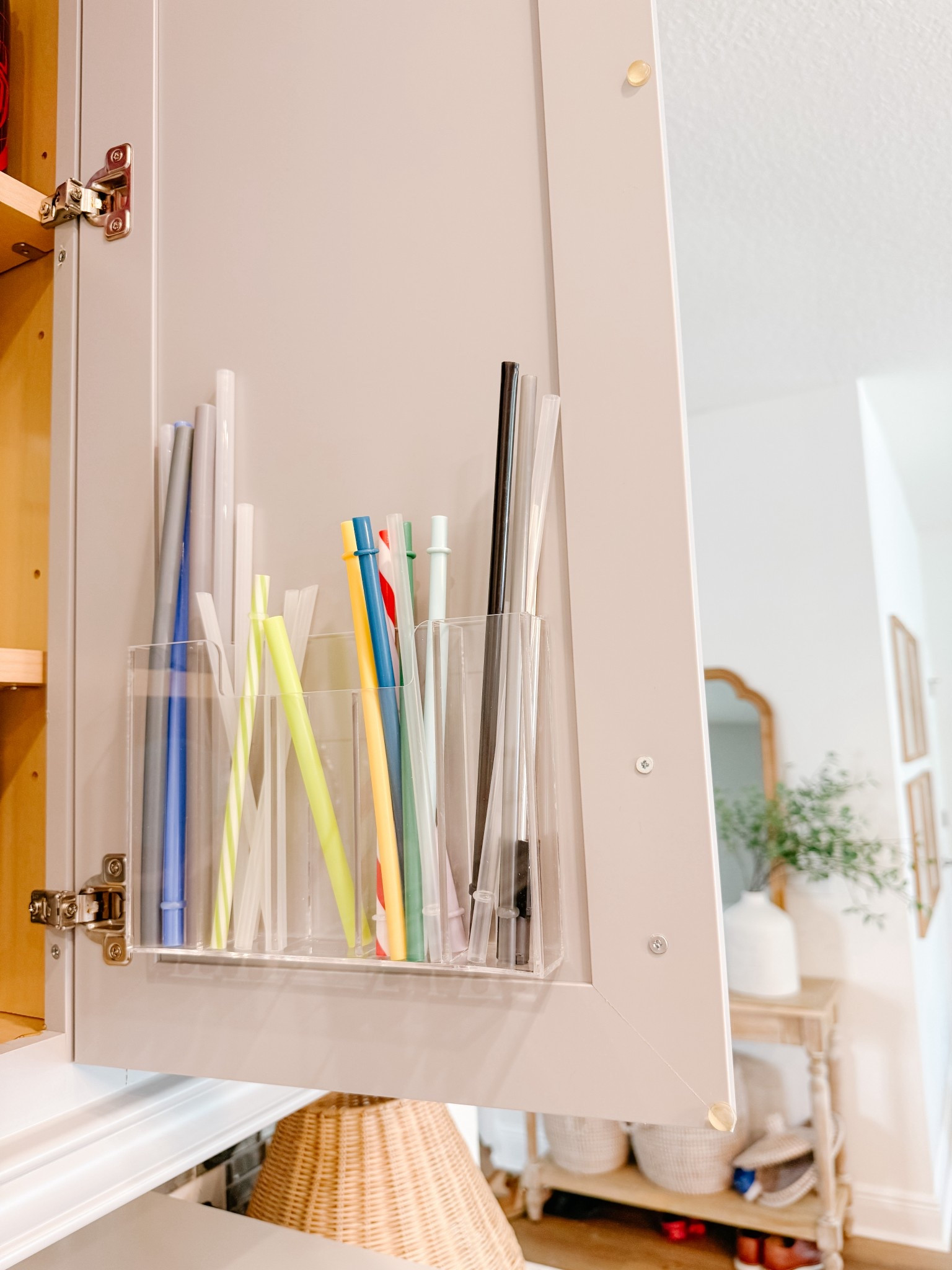 Acrylic straw holder that goes on the back of your cabinet! 