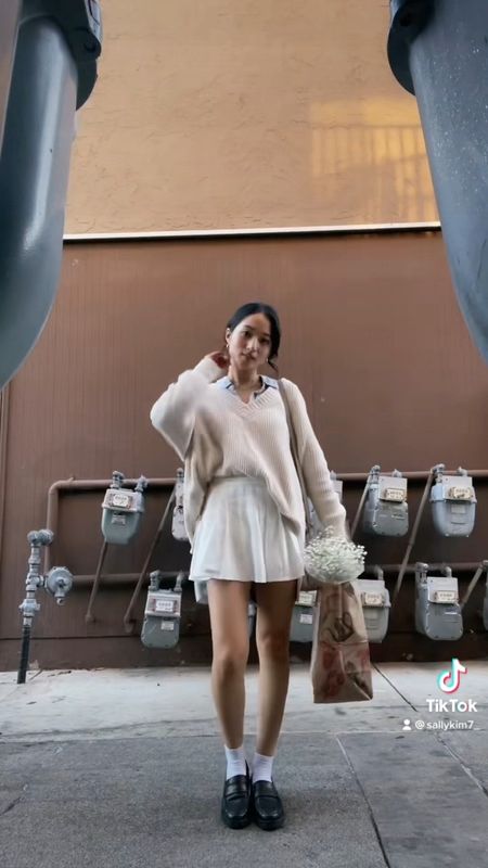 Preppy layering button down sweater mini tennis skirt fall spring fashion outfits korean look loafers bucket bag polene

#LTKSeasonal #LTKsalealert #LTKstyletip