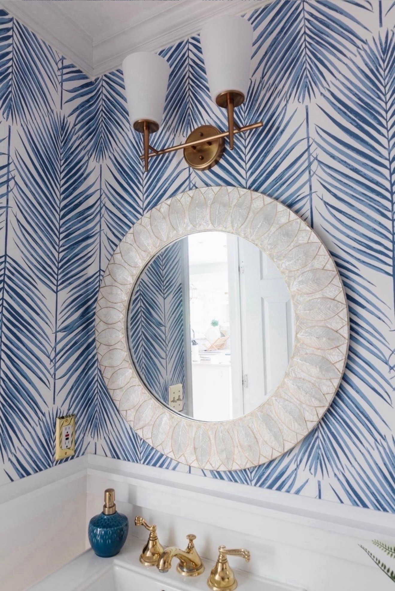 This coastal powder room with blue and white palm print wallpaper is one of my favorite small-space design moments. I love how the bold wallpaper paired with crisp white accents makes the room feel elevated, layered, and designer-inspired.

#LTKHome #LTKSaleAlert #LTKU