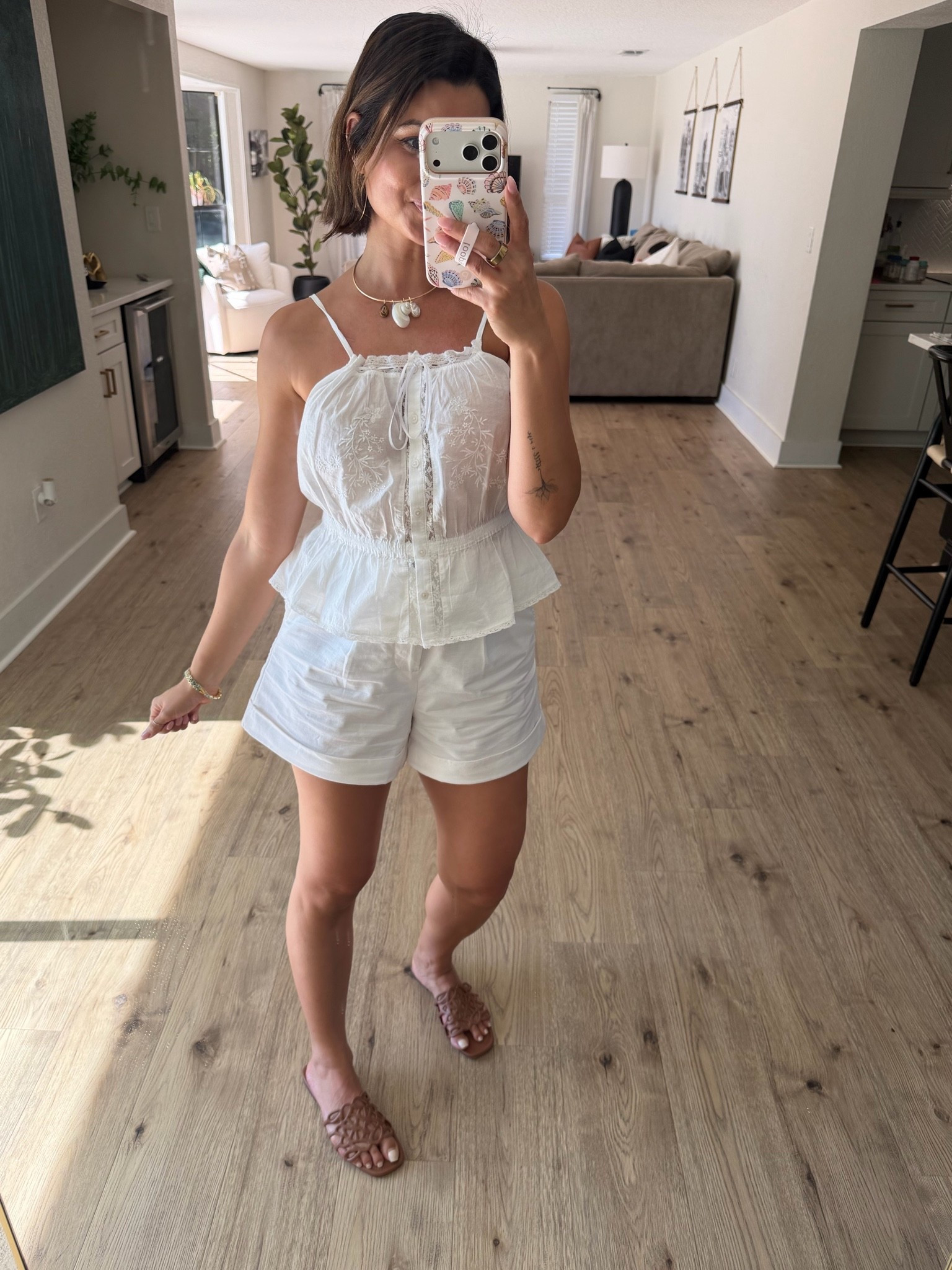 The all-white summer outfit I’ll be reaching for on repeat. 🤍 This embroidered cami is lightweight, feminine, and perfect with white shorts for vacation, brunch, beach days, or everyday summer outfits. Finished it off with neutral woven slides and layered jewelry.

#LTKootd #LTKgrwm #LTKSeasonal