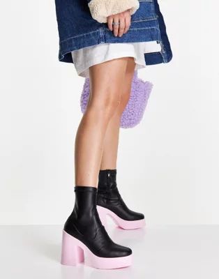 ASOS DESIGN Elsie high heeled sock boots in black with pink sole | ASOS (Global)