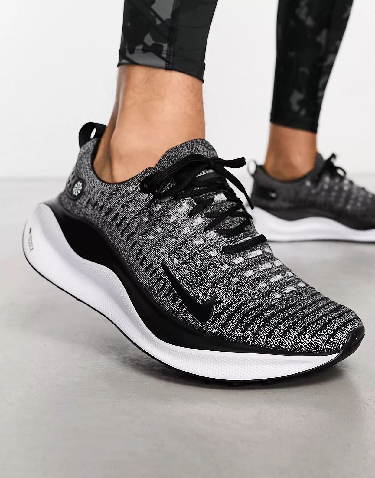 Nike Running React Infinity Run 4 Flyknit trainers in black and white | ASOS (Global)