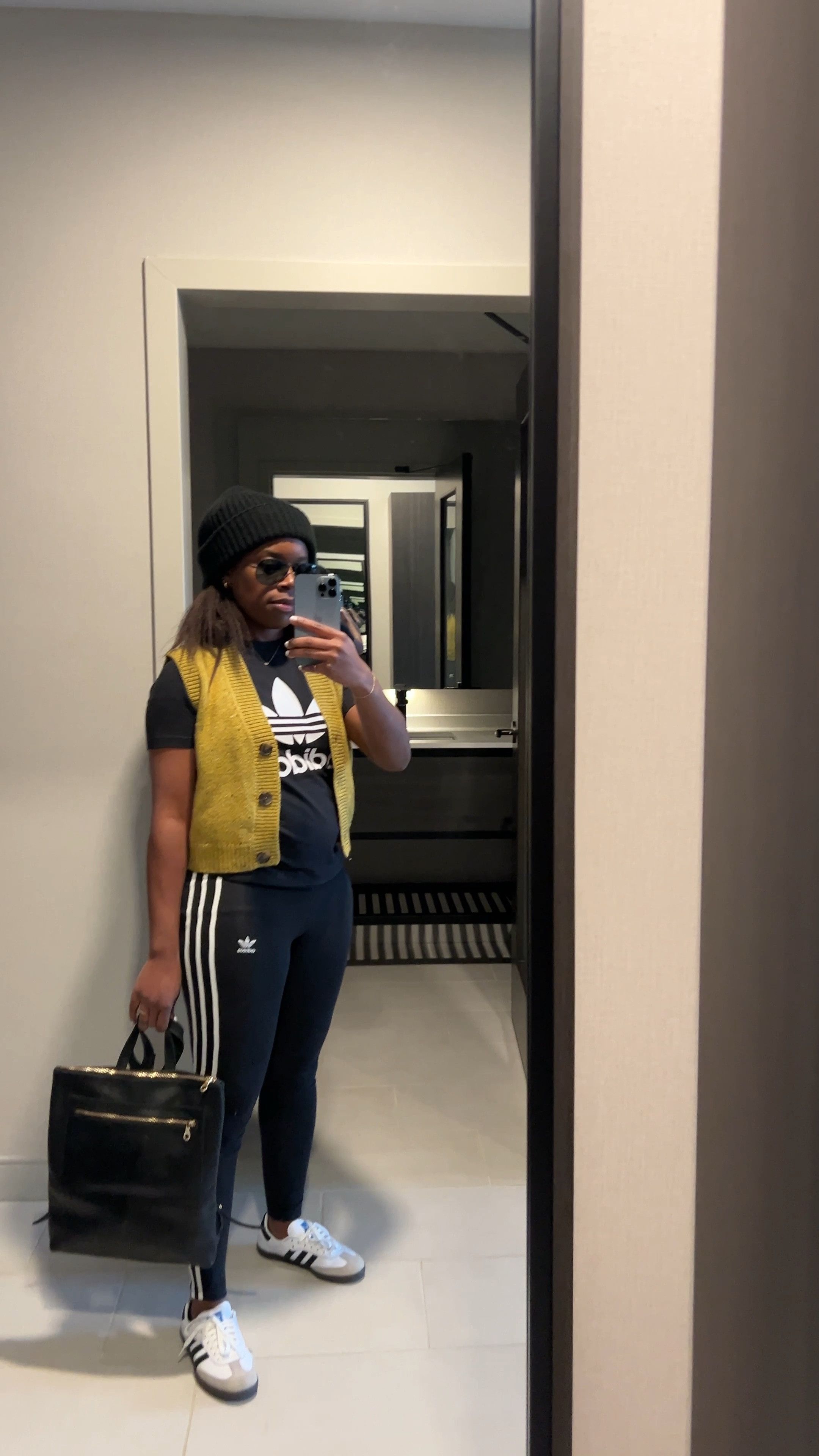 Casual comfy travel outfit for quick overnight getaway wearing adidas graphic tee, leggings, Samba sneakers, and sweater vest with leather backpack

#LTKshoecrush #LTKstyletip #LTKfindsunder50