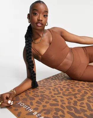 South Beach rib light support one shoulder sports bra in chocolate brown | ASOS (Global)