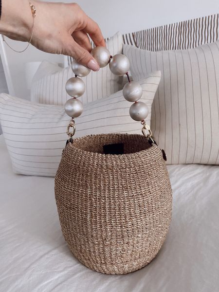 Love this oversized pearl handle on one of my favorite straw bags 

#LTKitbag