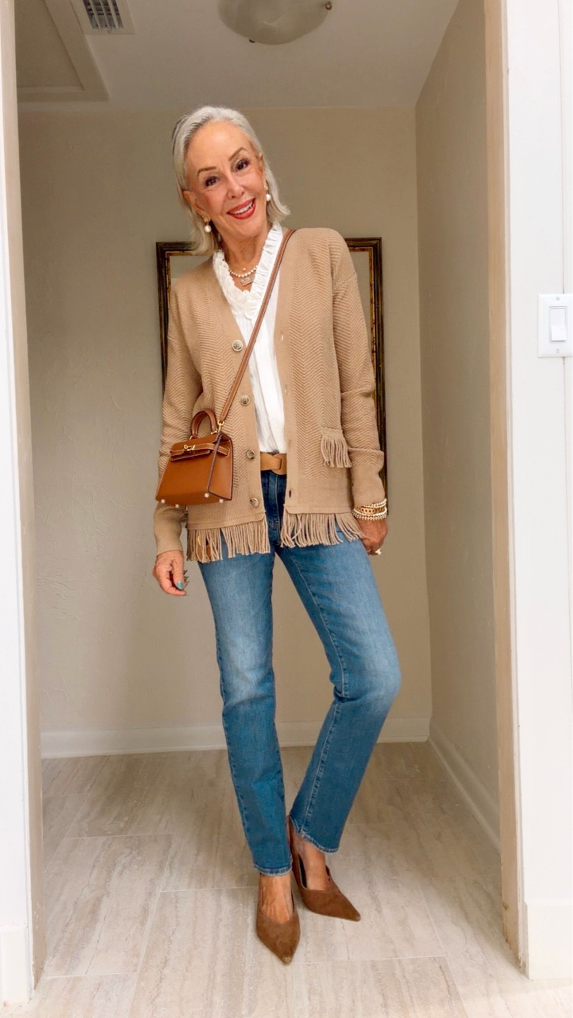 neutral fringed cardigan, a romantic ruffle-neck blouse and suede slingback kitten heels. OR switch gears completely with a graphic tee, denim and boots for an easy boho vibe.
I wear a size 0 in Chico’s unique sizing.
5’7” 132 lbs

#LTKOver40 #LTKWorkwear #LTKgrwm