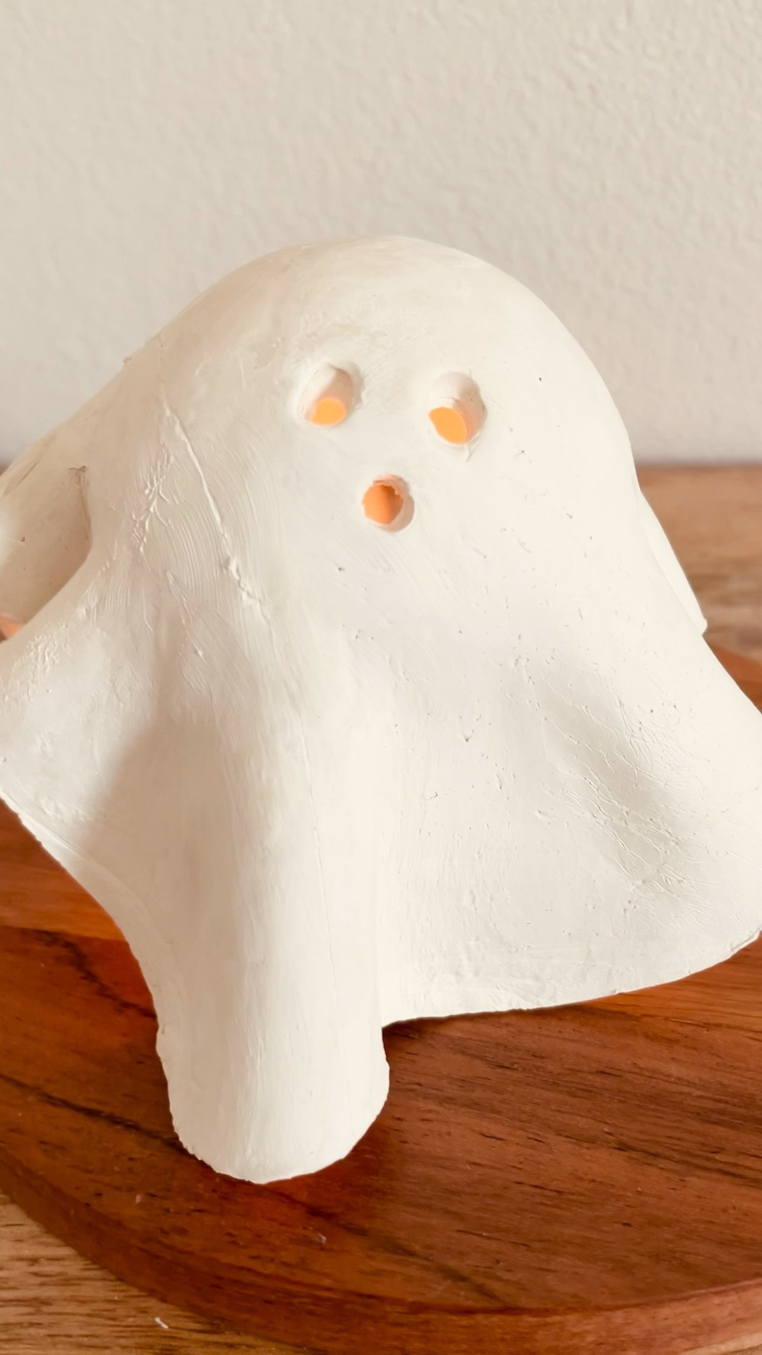 In true autumn spirit, I of course had to bring back this DIY! 👻

Here are all of the supplies to make your own DIY Mini Ghost Lamp!! 

Ready to get in the spooky mood? This simple and easy fall craft uses minimal supplies and doesn’t take much time to make! It looks sleek and modern and brings a cozy, warm glow during spooky season. 

Grab some air dry clay from any craft store, I used Crayola’s air dry clay. 

Roll a large chunk of clay flat (on top of a large piece of Glad Cling Wrap) as if rolling out sugar cookie dough.

Next, tape a small ball to the top of an upside down red Solo Cup. Cover this drying stand with some Glad Cling Wrap to avoid your ghost from sticking while it dries!

Cut the perimeter of your flattened clay into an (imperfect) circular shape.

Then lift the clay circle by the Glad Cling Wrap underneath and gently lay it over your solo cup drying stand. Gently press clay down around cup, creating drape like curves.

Puncture three holes for eyes and a mouth using a straw (use your creative freedom to give the ghost your desired personality).

Wait 2-3 days for air dry clay to fully dry. Gently lift ghost off the stand. Leave your ghost with an organic clay finish or customize it with paint.

Find a cute place to display your ghost & place a battery operated tea light candle underneath (opt for a battery operated candle to avoid overheating the clay with a real flame, I linked my favorite ones)!

#halloweendecor #halloweendiy
#diyhalloween #halloween #decoratewithme #ghostdiy #halloweendecor #organicmodern #neutralstyle  

#LTKHome