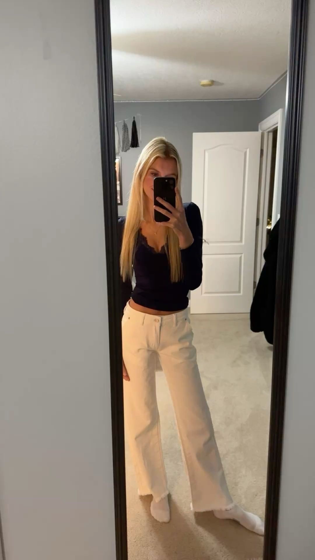 Ediktd low rise white jeans with navy long sleeve

#LTKTravel #LTKTall #LTKootd