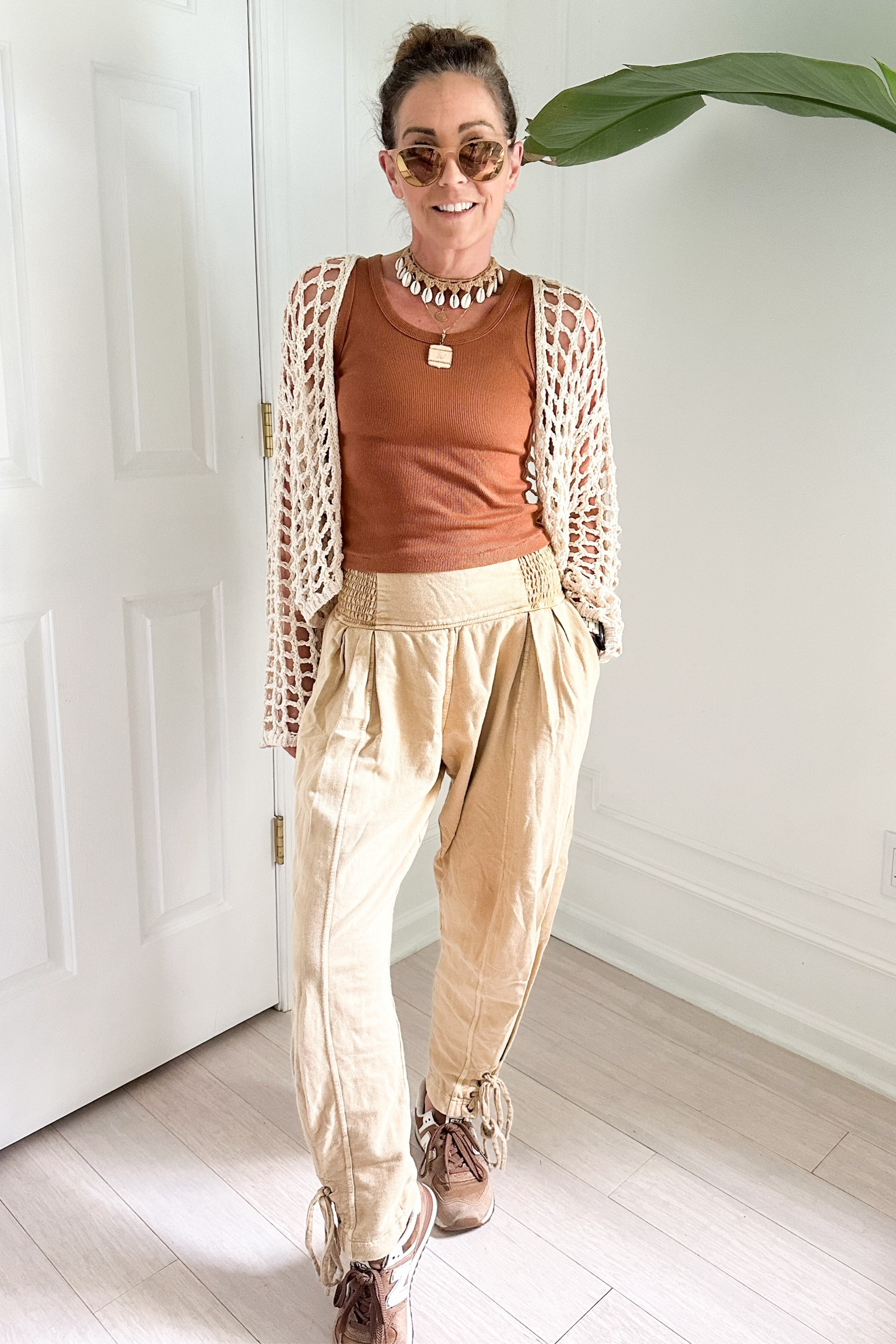 This is one of my favorite beachy comfy outfits. These Free People sweatpants are so unique and can be dressed up or down. This crochet jacket is from Garage Clothing last year but I linked similar ones. The tank top is the perfect length for high waisted pants and comes in different colors. Also love the seashell choker (I’m wearing XS pants and S tank top) could be a festival outfit, vacation outfit, travel outfit

#LTKstyletip #LTKover40 #LTKFestival