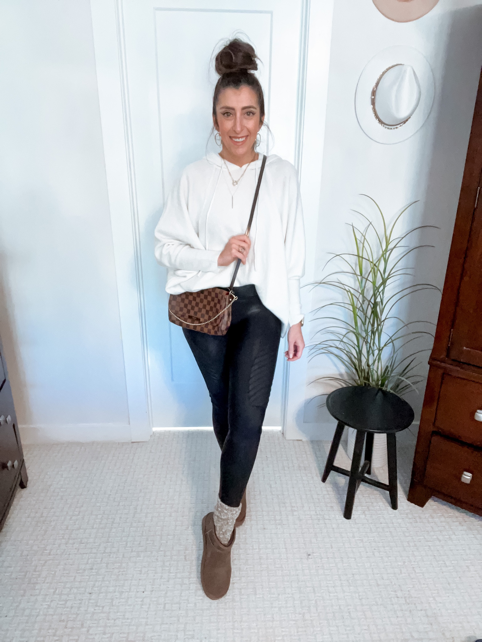 Casual winter leggings look. Moto faux leather, checkered crossbody, white hoodie, Ugg booties

#LTKshoecrush #LTKstyletip #LTKcurves