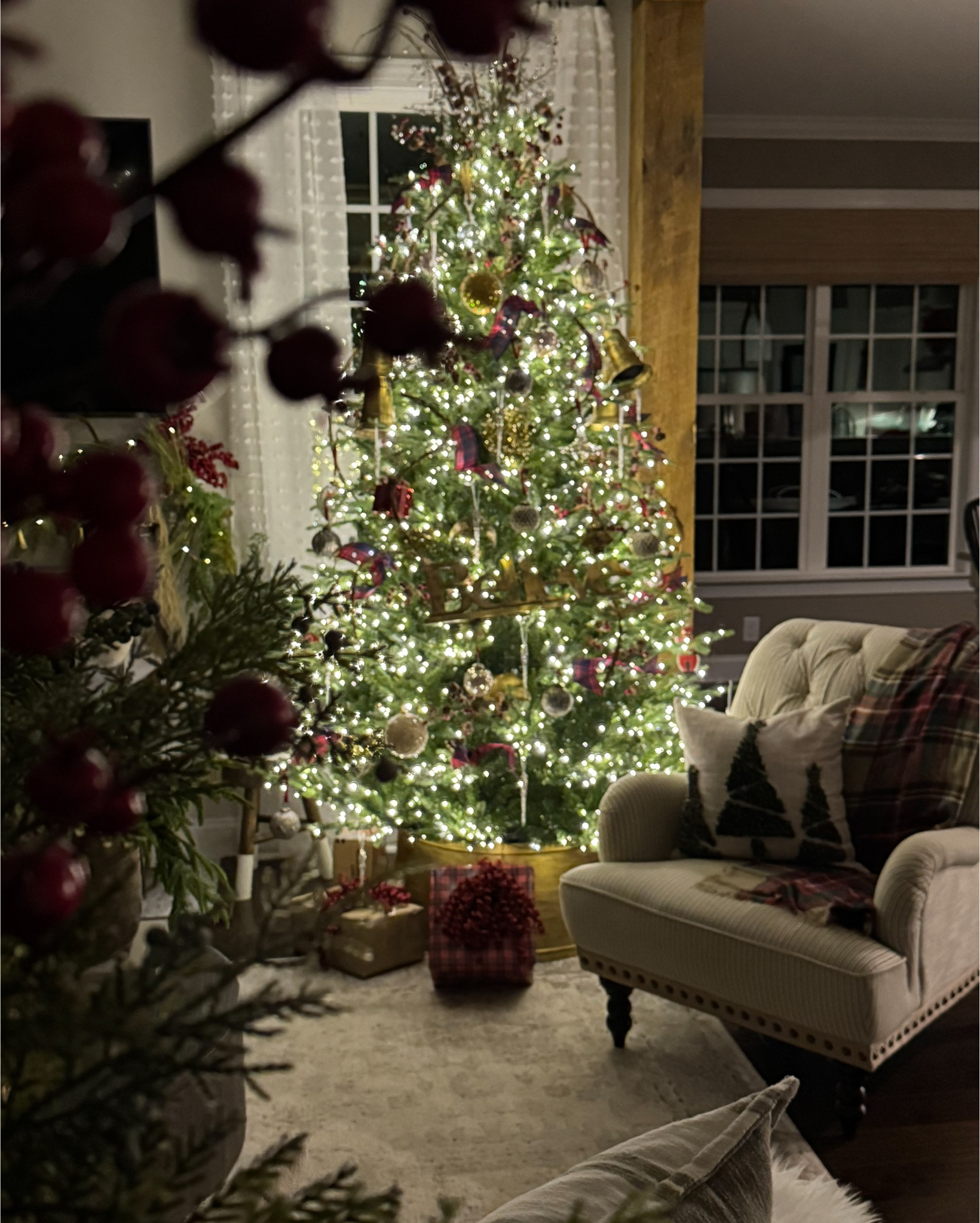My nighttime Christmas entryway and living room!! Everything is glowing and so magical this time of year.

Grand Duchess Christmas tree, 
Christmas tree pillow covers, reindeer, garland, gold bells, vintage inspired ornaments,
grapevine garland, gold tree collars, berry stems, chandelier, velvet ribbon, floor lamp with woven shade, bell garland, faux fur stockings, large gold shatterproof ornaments, Norfolk pine stems, plaid scarf, stocking name tags, mini Christmas tree, woven storage boxes, upholstered side chair, faux fur rug, Henn console table, bronze urn 


#LTKHome #LTKHoliday #LTKSeasonal