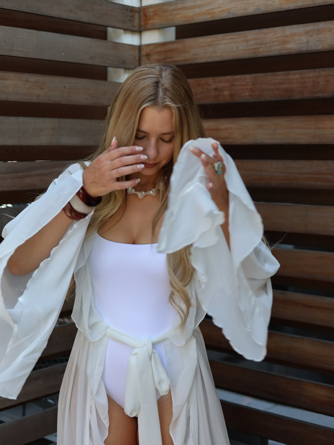 Lakeside luxury. This serene look features a light blue strapless linen maxi dress, elegantly paired with a cognac leather tote and matching pointed-toe flats. #LinenDress #SummerStyle #LTKbeach 

 #LTKdayinmylife #LTKootd #LTKSaleAlert