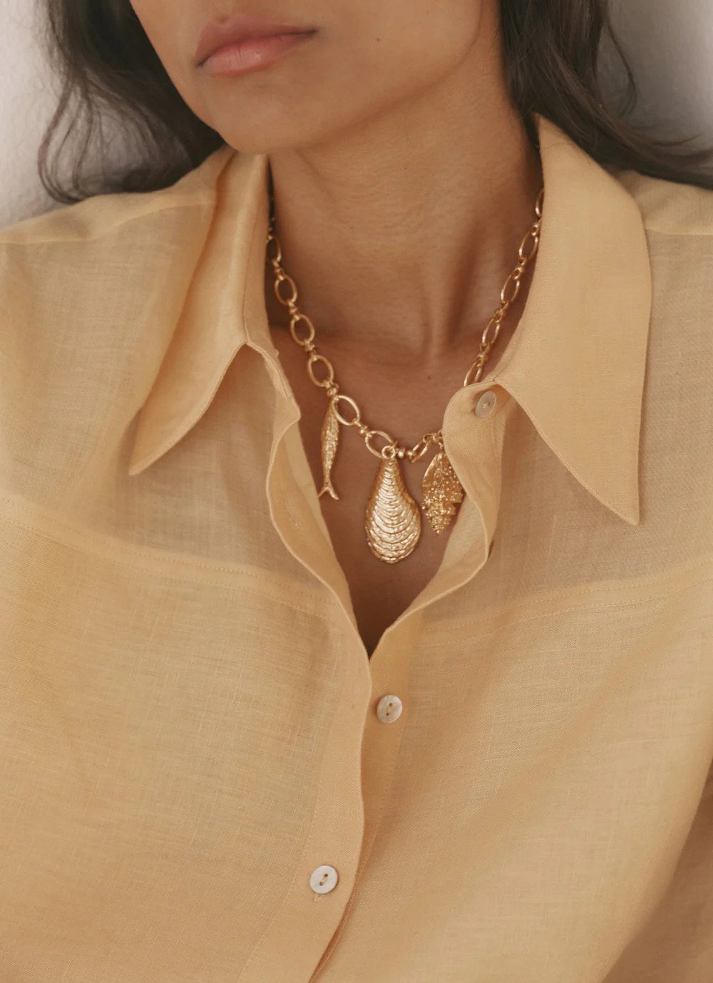 Gold Tone Shell Statement Charm Necklace | Mint Velvet