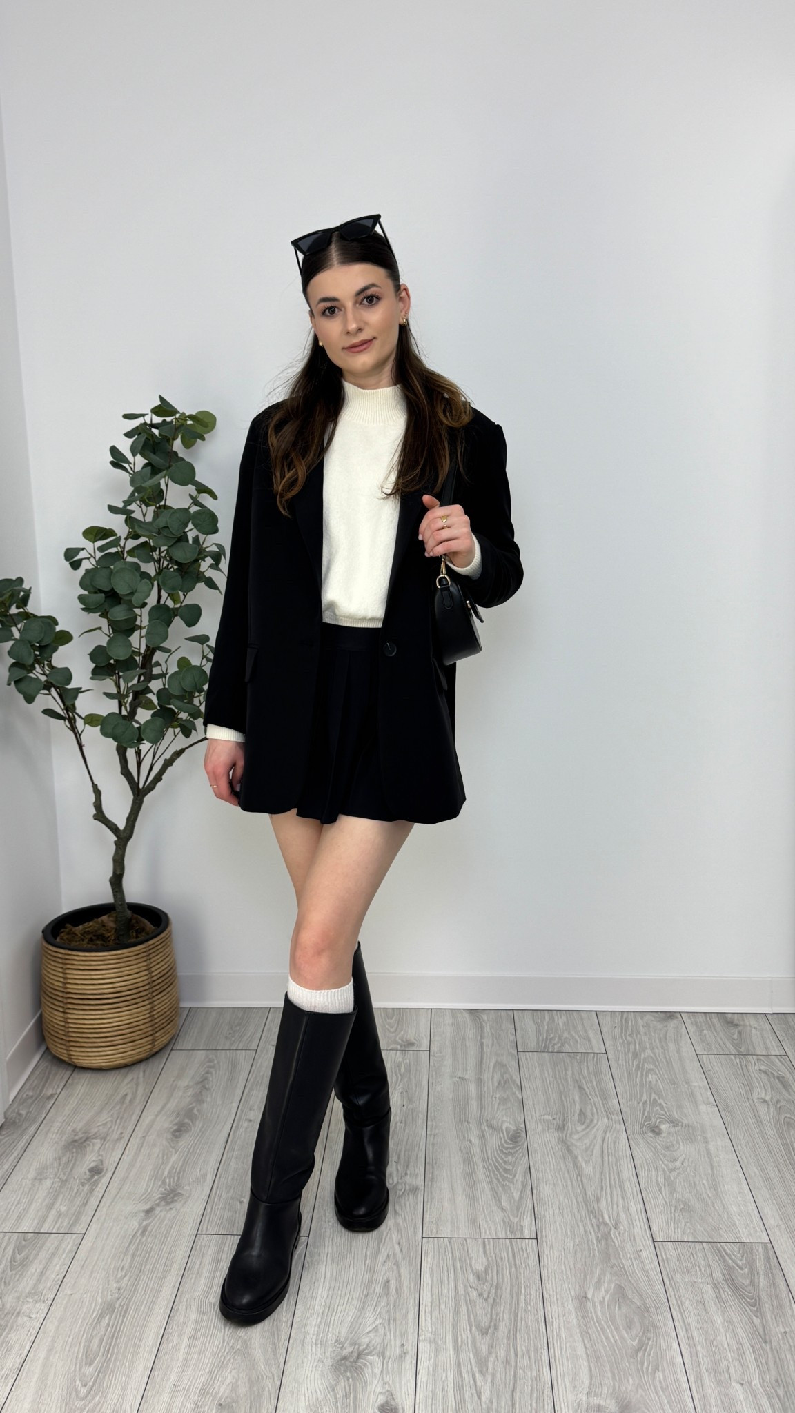 Cream jumper, black mini pleated skirt, black blazer, white bambi leg warmers, black knee-high boots, black purse, sunglasses. A perfect blend of sleek and cozy 💛 #IlaStylesDiary

#LTKeurope #LTKworkwear #LTKspring
