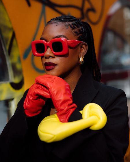When I wear all black looks, I like to pair it with pops of color in my accessories. These red inflated Loewe sunglasses are too good. I wore red leather gloves and a yellow mini crescent shaped bag. 

#LTKitbag