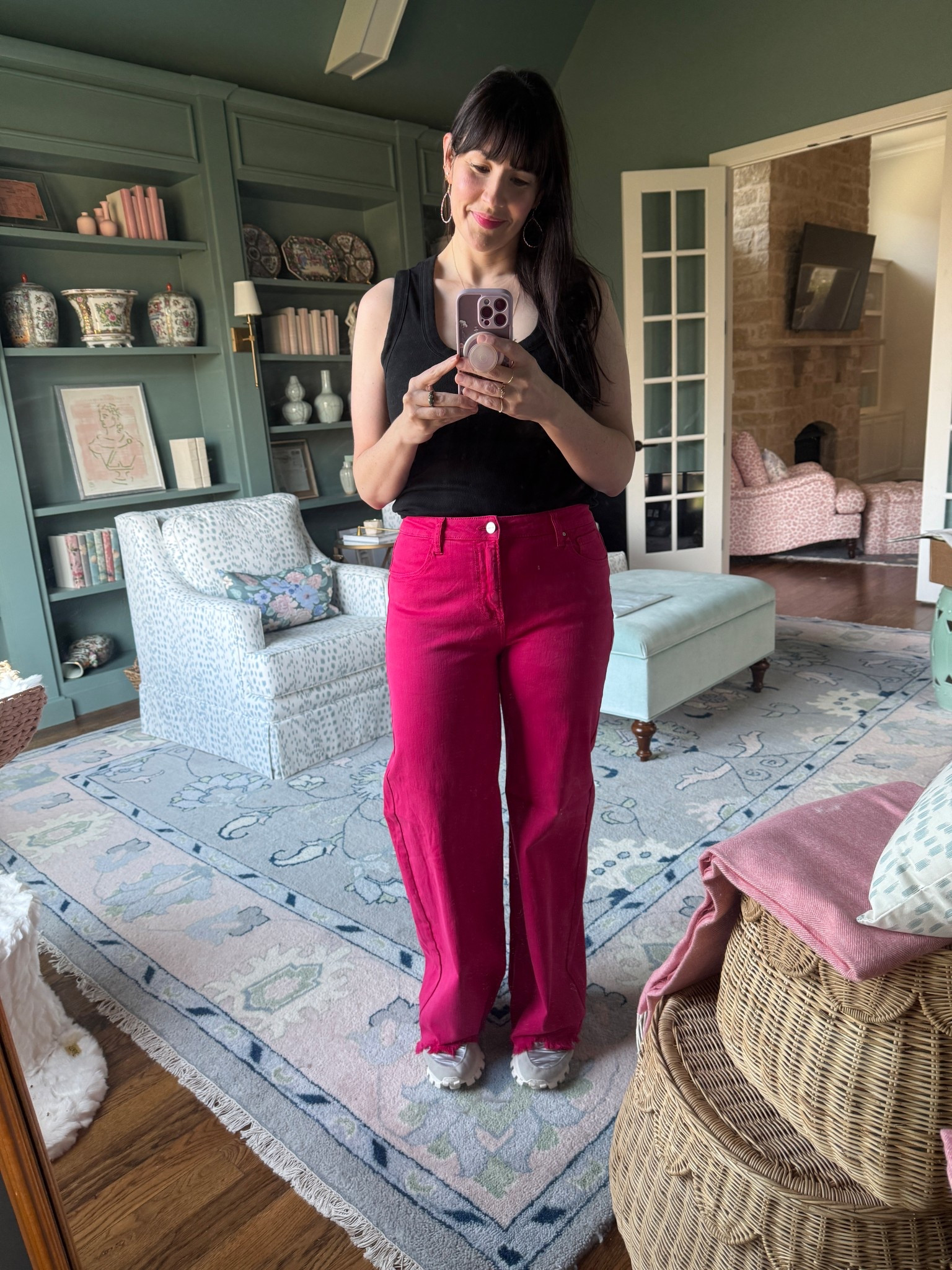 Pink jeans, black tank top 