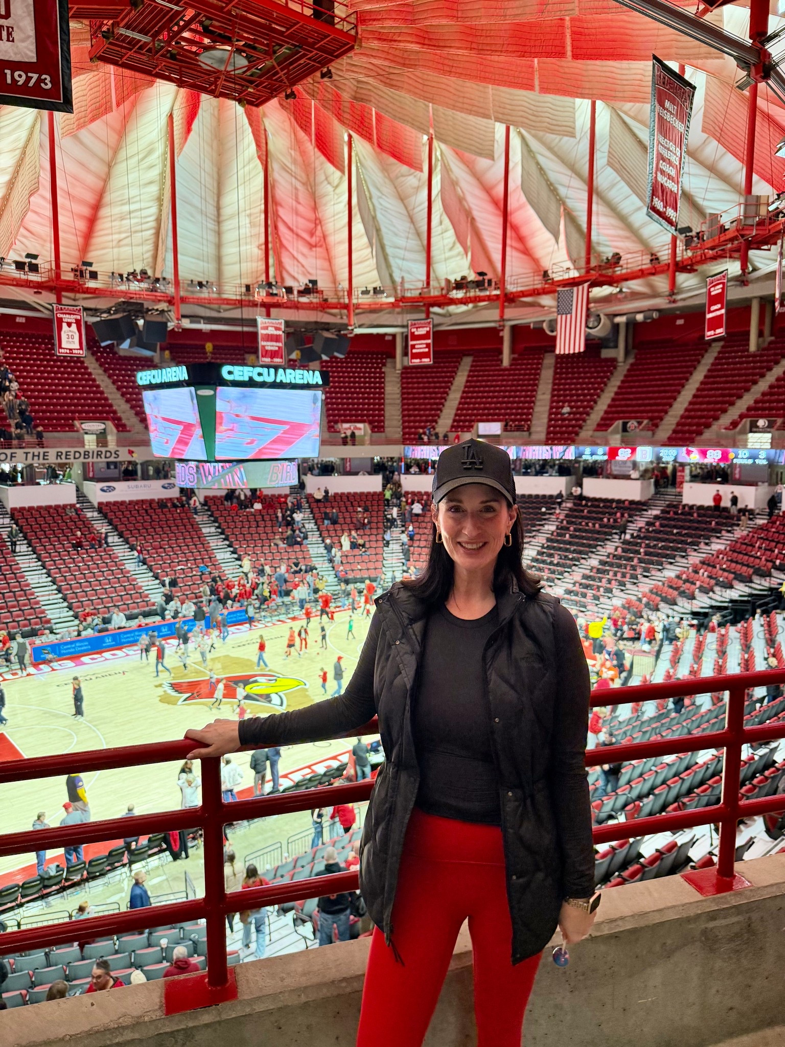 #OOTD for the Illinois State University vs Bradley University Game today for the war on 74! Such a fun afternoon! 
Went in game day colors, red SPANX leggings, black SPANX OnForm Top, Black The North Face Vest, Lululemon belt bag, Black LA Dodgers Trucker Hat from Aritzia. Paired with cutesy Aritzia socks and my new black Reeboks! 
My earrings are Linny Co and save $$ with my code, HBO15
My make up is my quick five minute glow with all pieces linked! 

#LTKOver40 #LTKActive #LTKootd