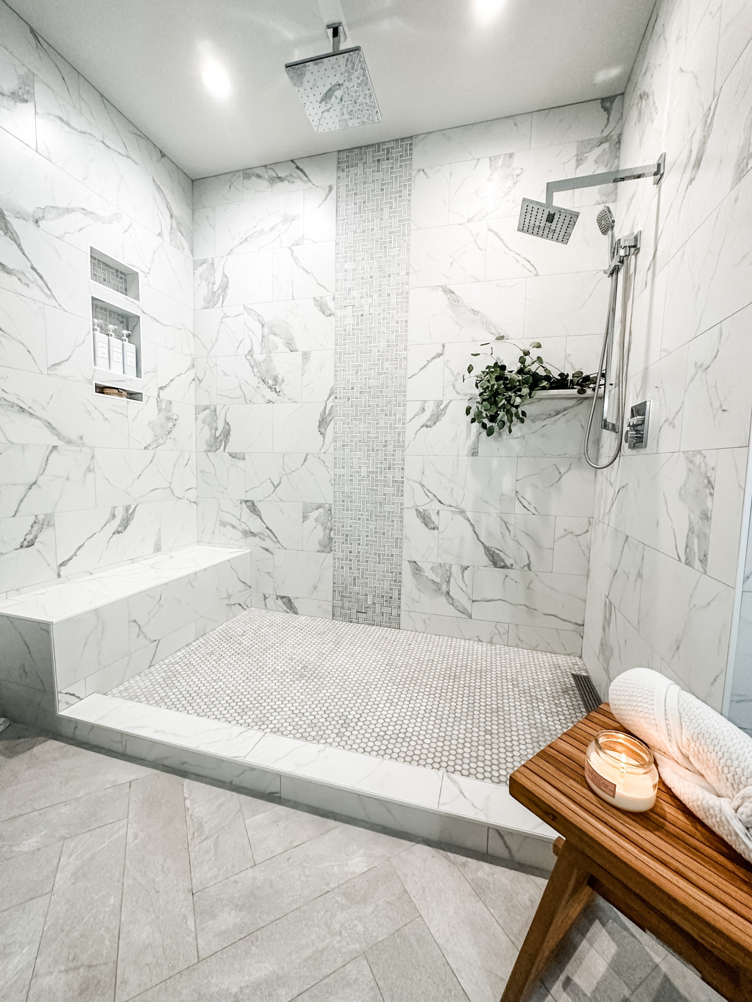 Master bathroom shower must haves 

Rain shower head, shower, bathroom, tile shower, marble bathroom, Ghroe, accent wall, white bathroom, shampoo bottles, labels, chrome fixtures, teak stool, towels, candles, fan light, multicolor light, 
