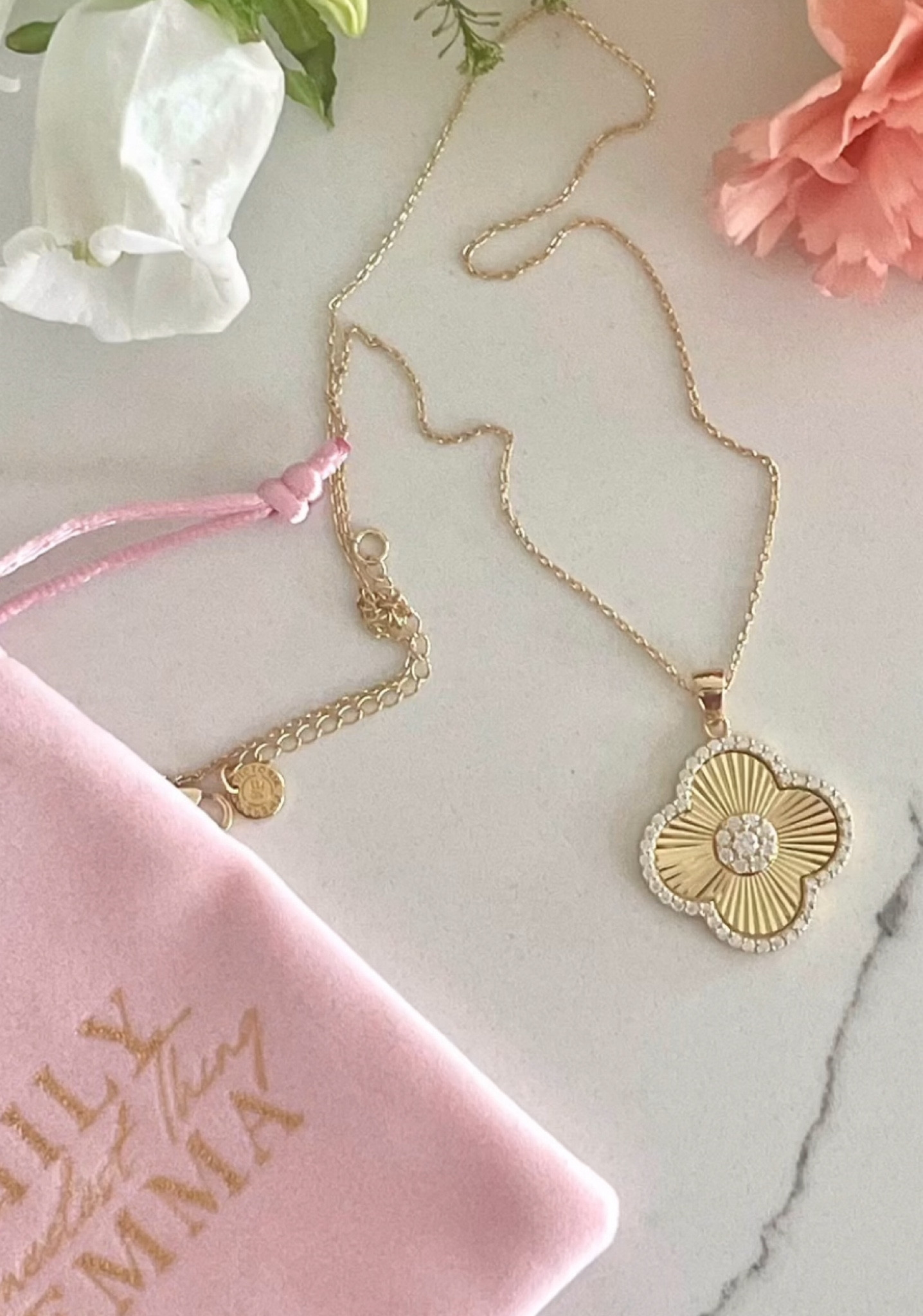 A large clover pendant set with pavé micro crystals and made with our long-lasting 18K gold vermeil. Hangs on a dainty cable chain keeping the pendant as the focal point. 

#LTKFindsUnder100 #LTKFallSale #LTKStyleTip